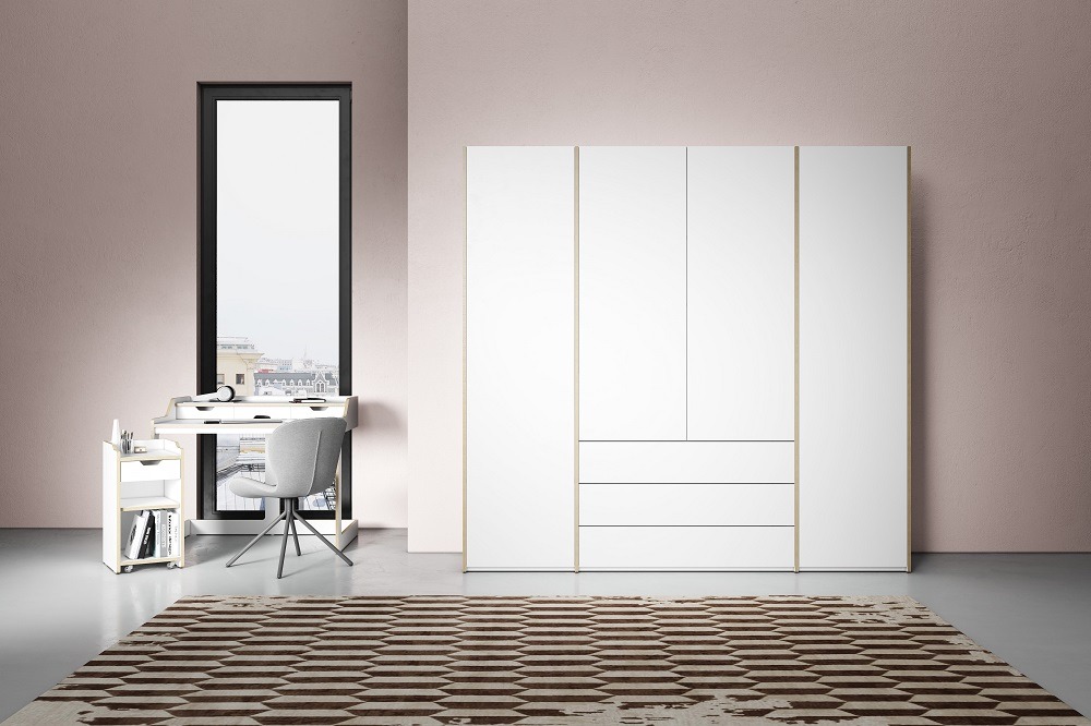 Weißer MODULAR PLUS Schrank von Müller Möbelwerkstätten mit Schubladen und Drehtüren im modernen Raum.