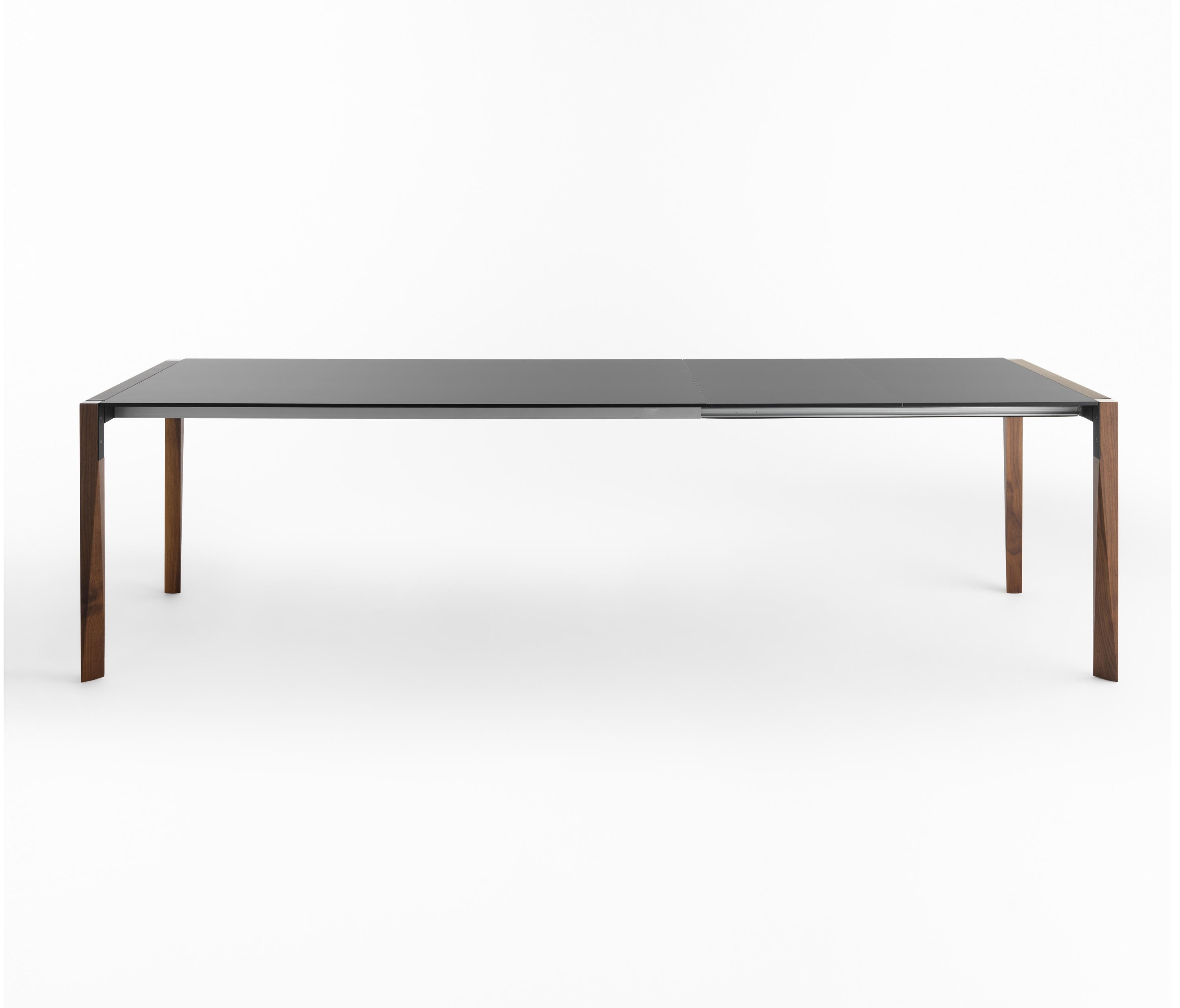 Tango Estensibile Ausziehtisch von Casamania Horm mit dunkler Glasplatte und Holzbeinen.