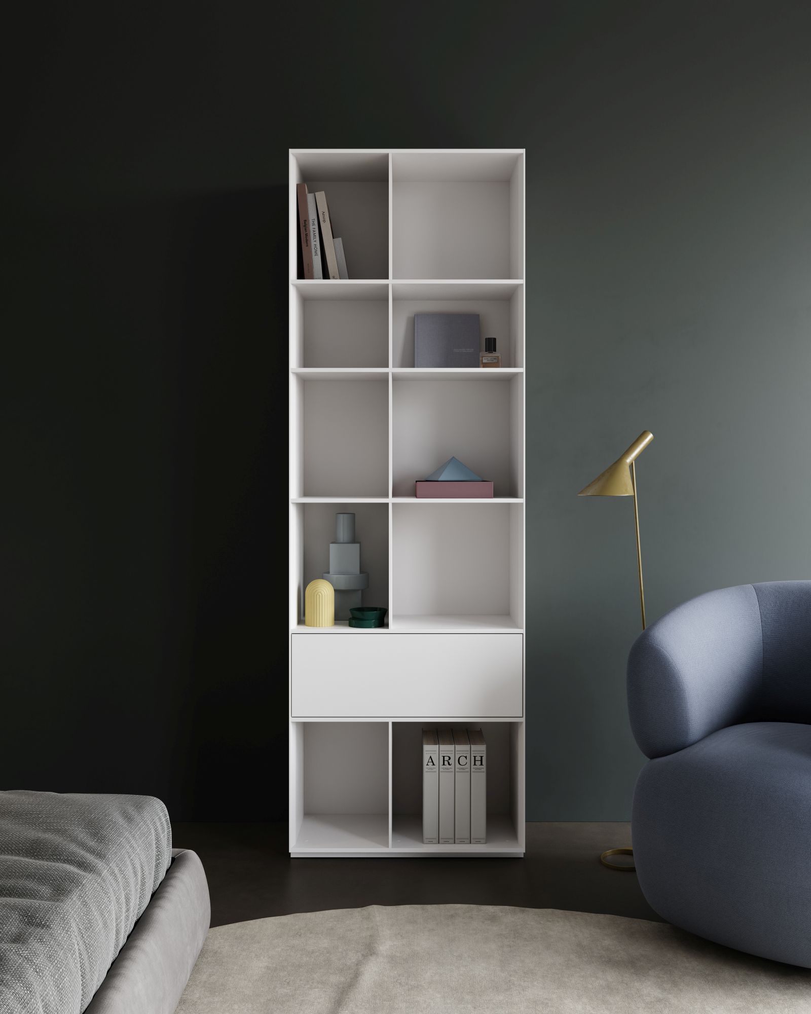 Weißes Nex Pur Regal von Piure mit Schublade und offenen Fächern, gefüllt mit Deko-Objekten.