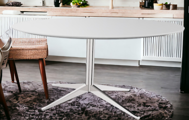 Florence Tisch: Runder Esstisch von Knoll International mit weißer Tischplatte und Metallfuß.