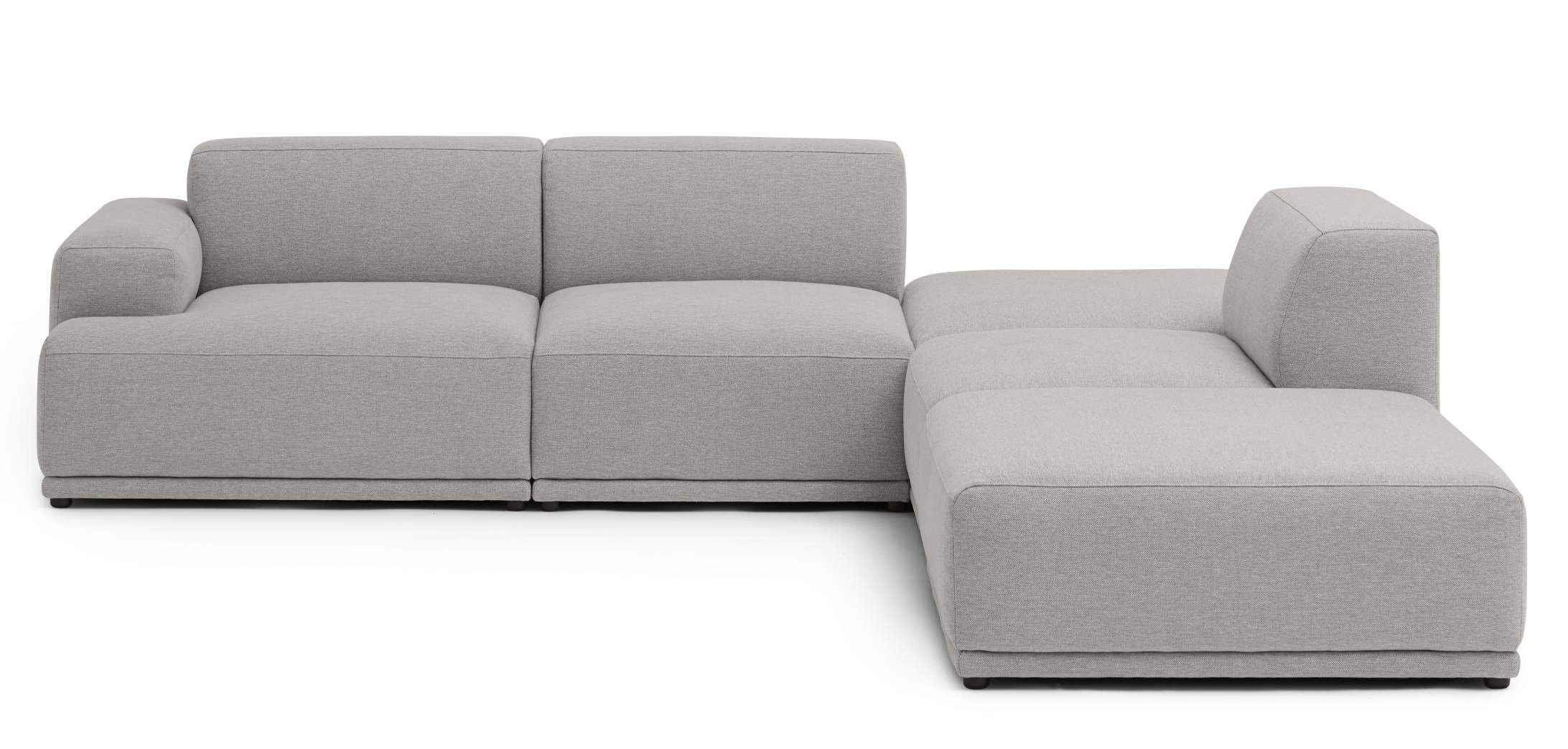 Graues Connect Soft Modular Sofa von Muuto in Eckkonfiguration mit hellgrauem Stoffbezug.