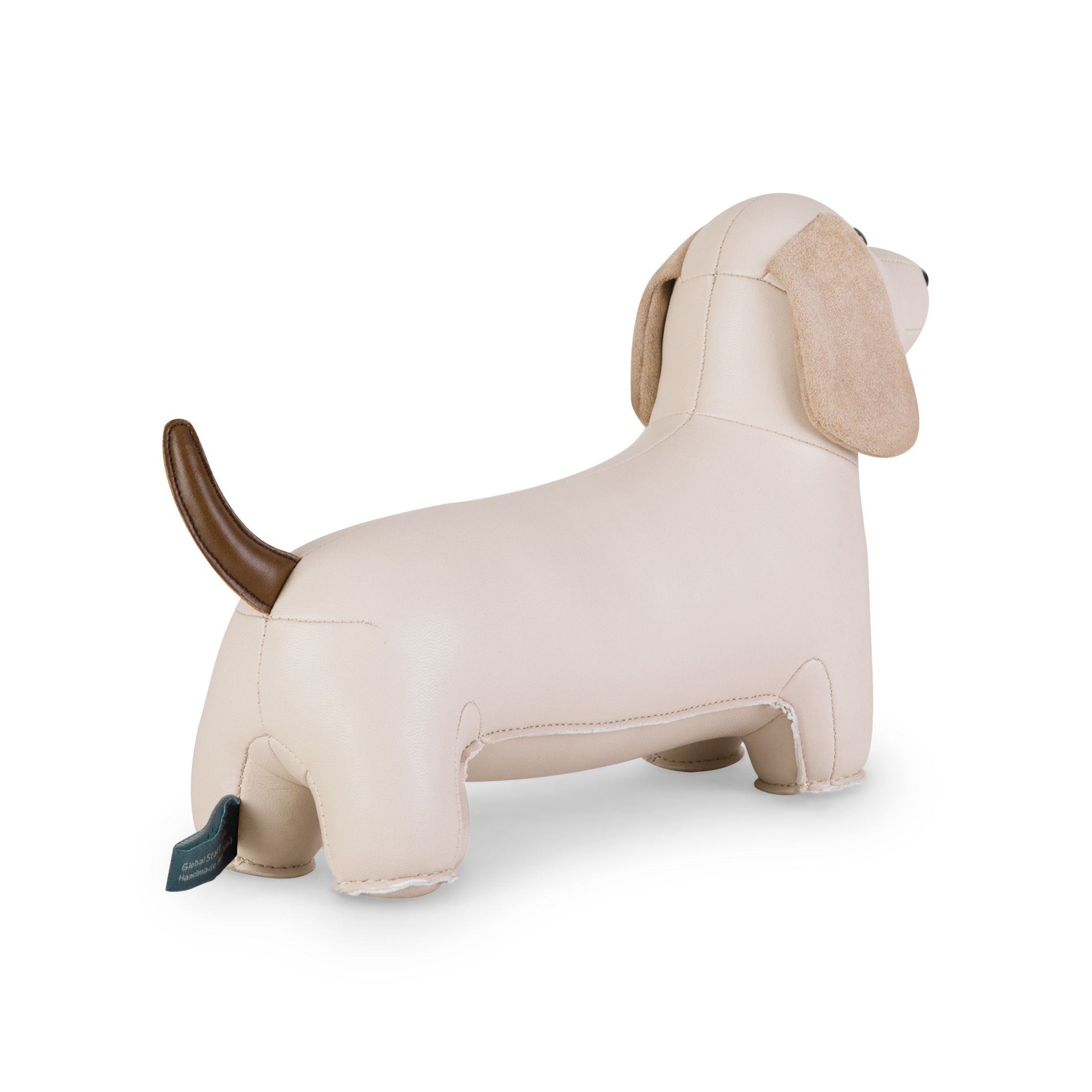 Buchstütze Dackel von Züny, weizenfarbenes Kunstleder, brauner Schwanz, dekorative Tierfigur für Bücherregale.