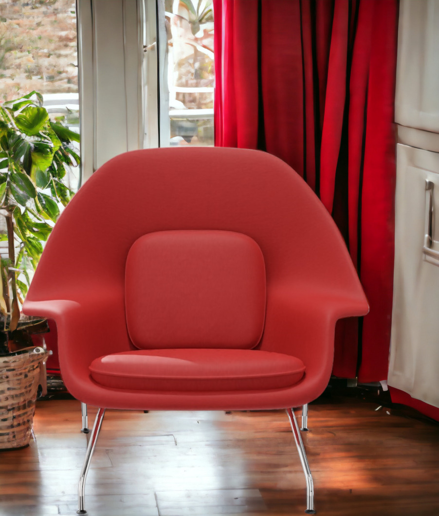 Roter Womb Chair Sessel von Knoll International mit Stahlbeinen und rotem Kissen vor Fenster.