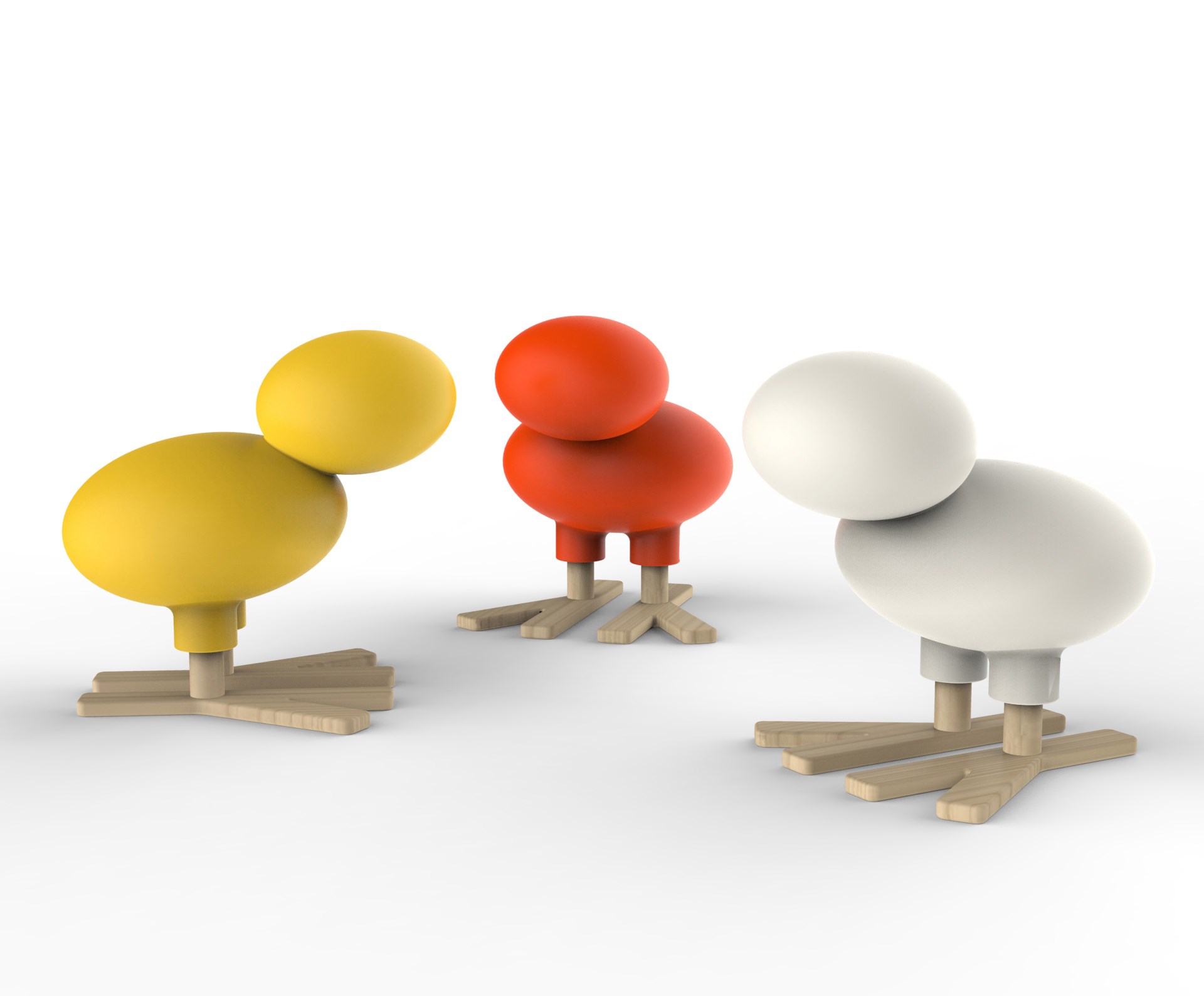 Drei Happy Bird Figuren von Magis in Gelb, Rot und Weiß auf weißem Hintergrund.