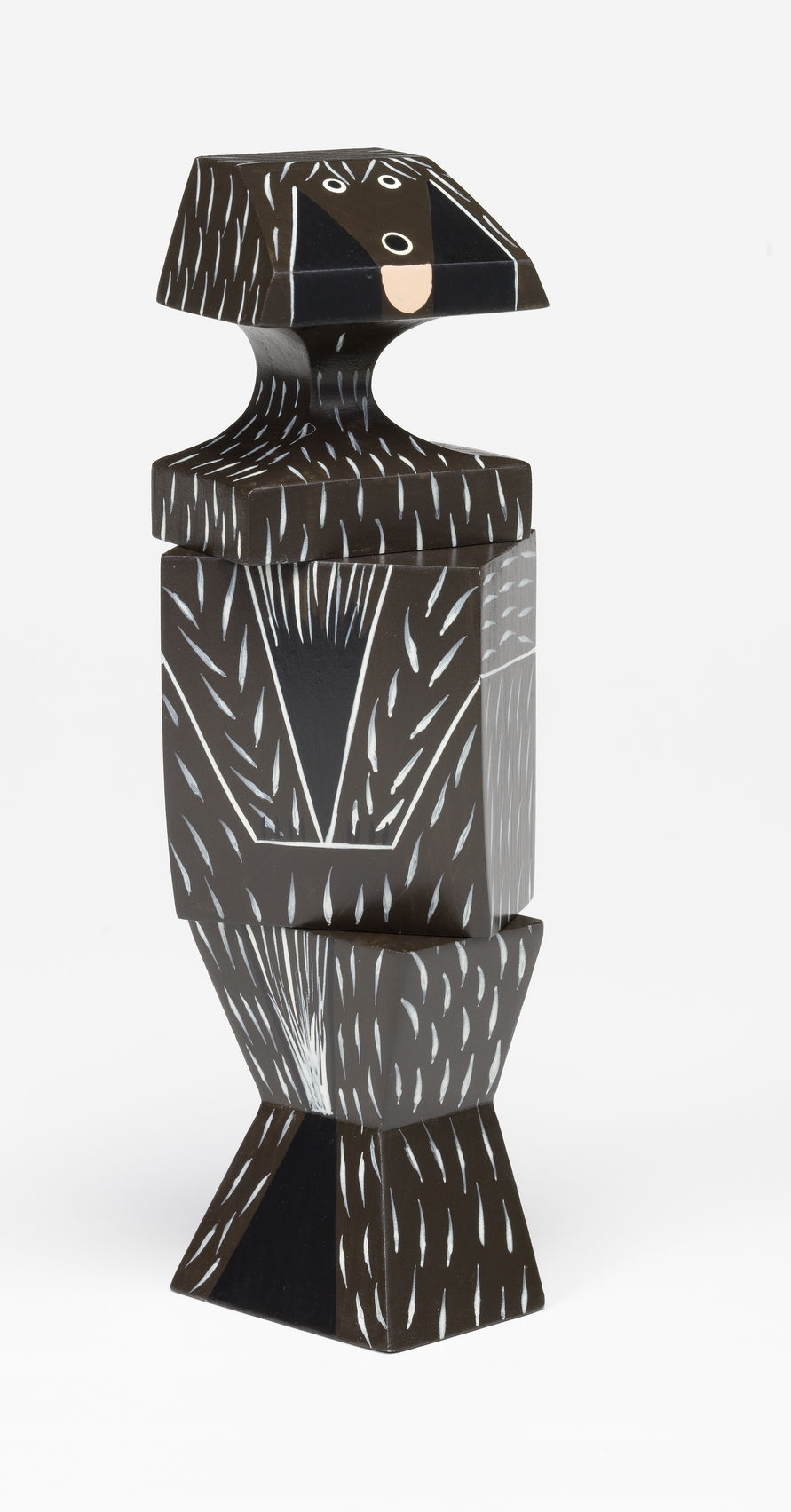 Vitra Wooden Doll Hund, dekorative Holzfigur, braun und schwarz mit weißen Akzenten.