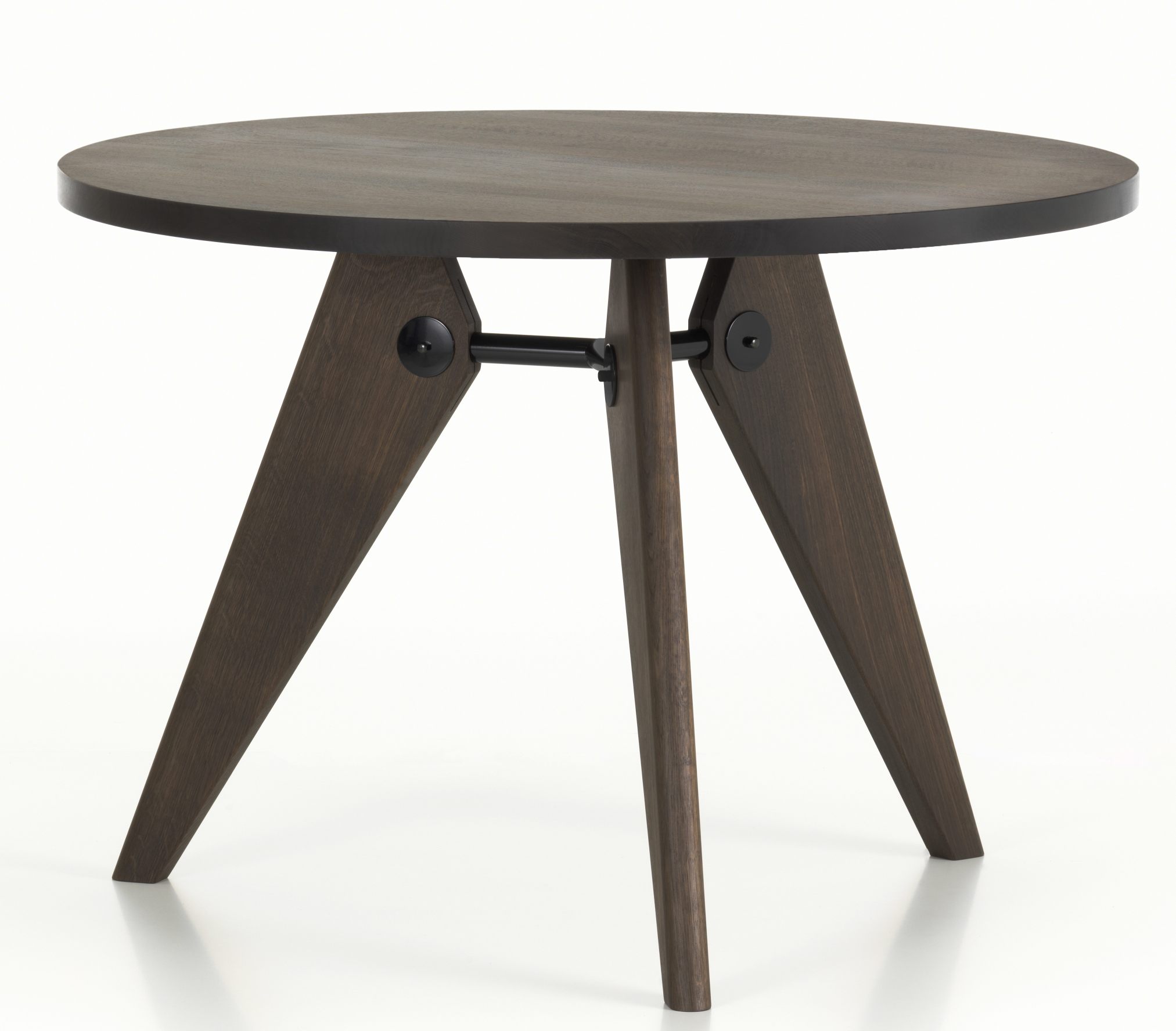 Gueridon Tisch von Vitra: Runder Esstisch aus dunklem Holz mit drei Beinen.