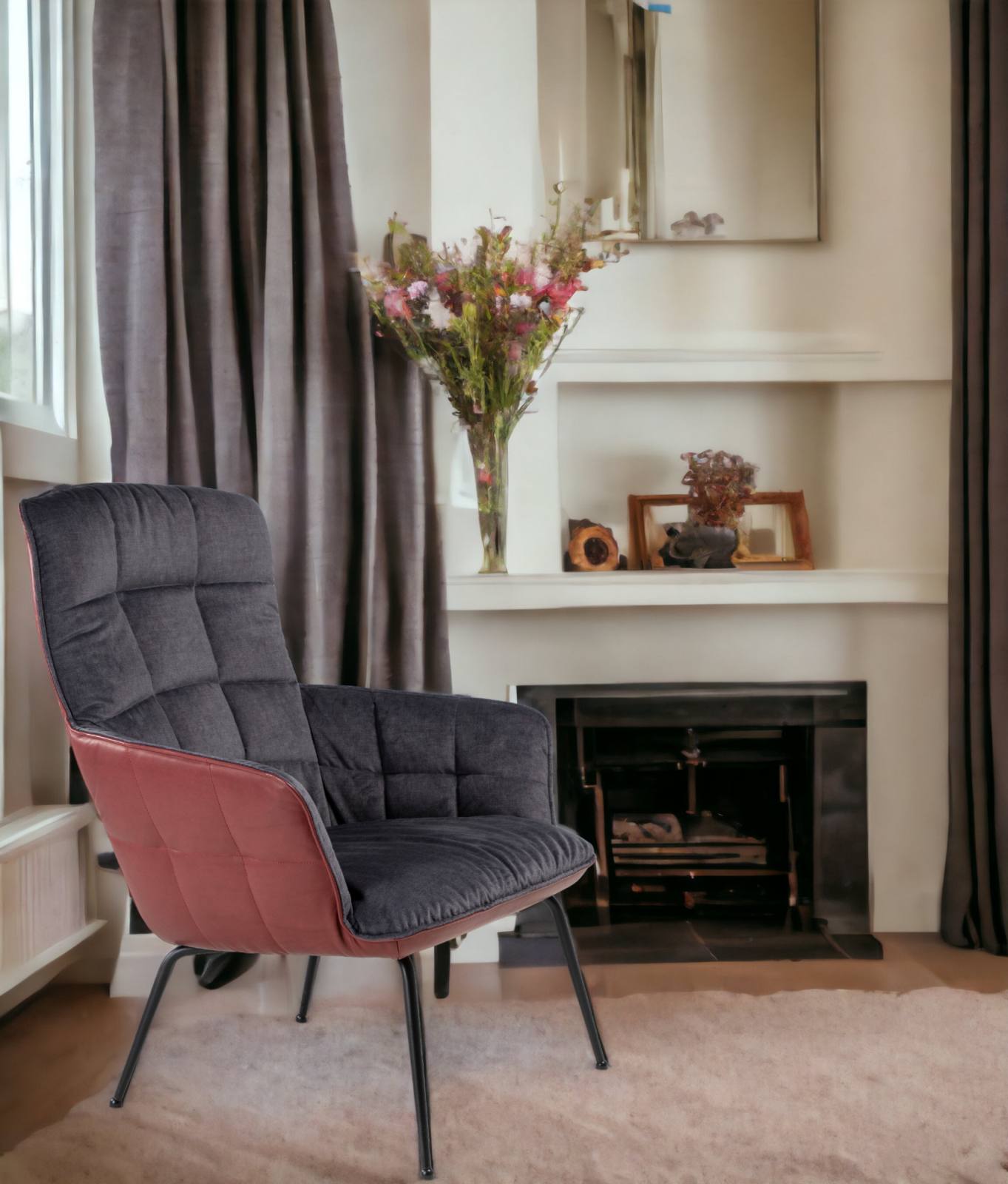 Marla Easy Chair High Sessel von Freifrau Manufaktur in Grau und Rot vor Kamin.