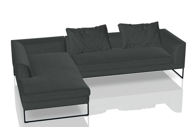 Graues Mell Lounge Sofa mit Recamiere und Kissen auf schlanken, schwarzen Füßen.