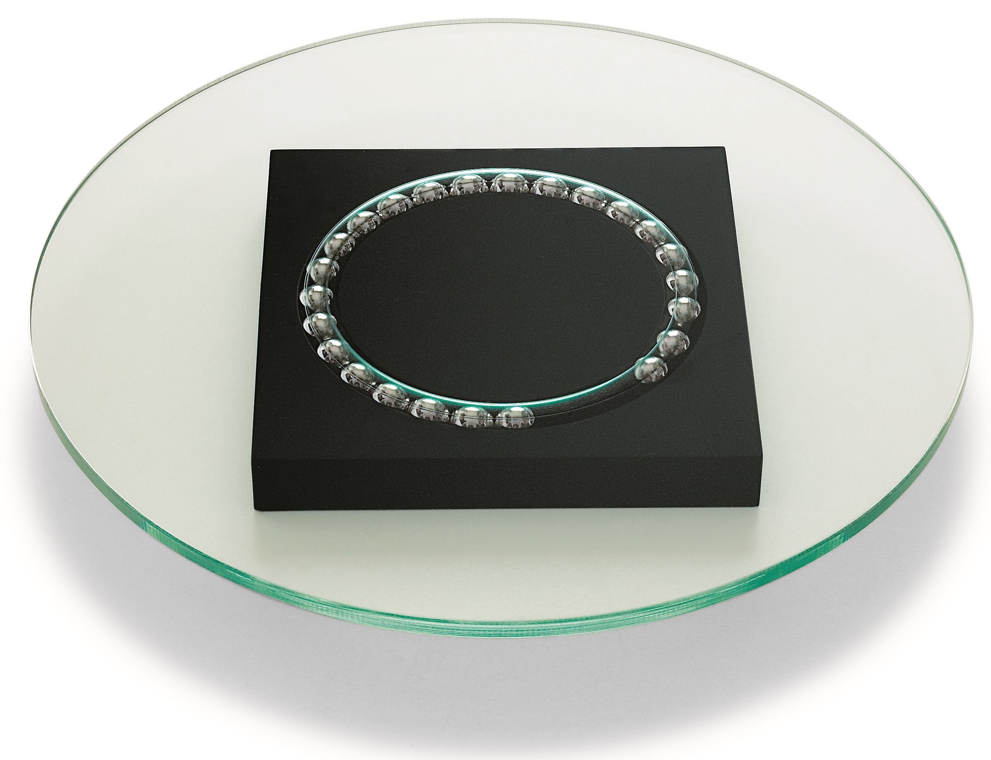 Philippi Lazy Susi Drehteller aus Glas mit schwarzem Sockel und Kugellager für Tischdekoration.