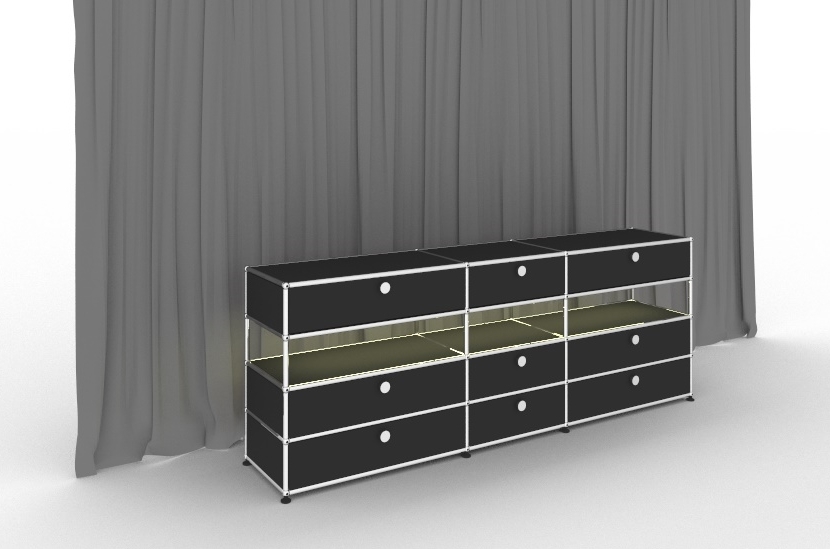 Schwarzes USM Haller Sideboard mit Beleuchtung und neun Schubladen vor grauem Vorhang.
