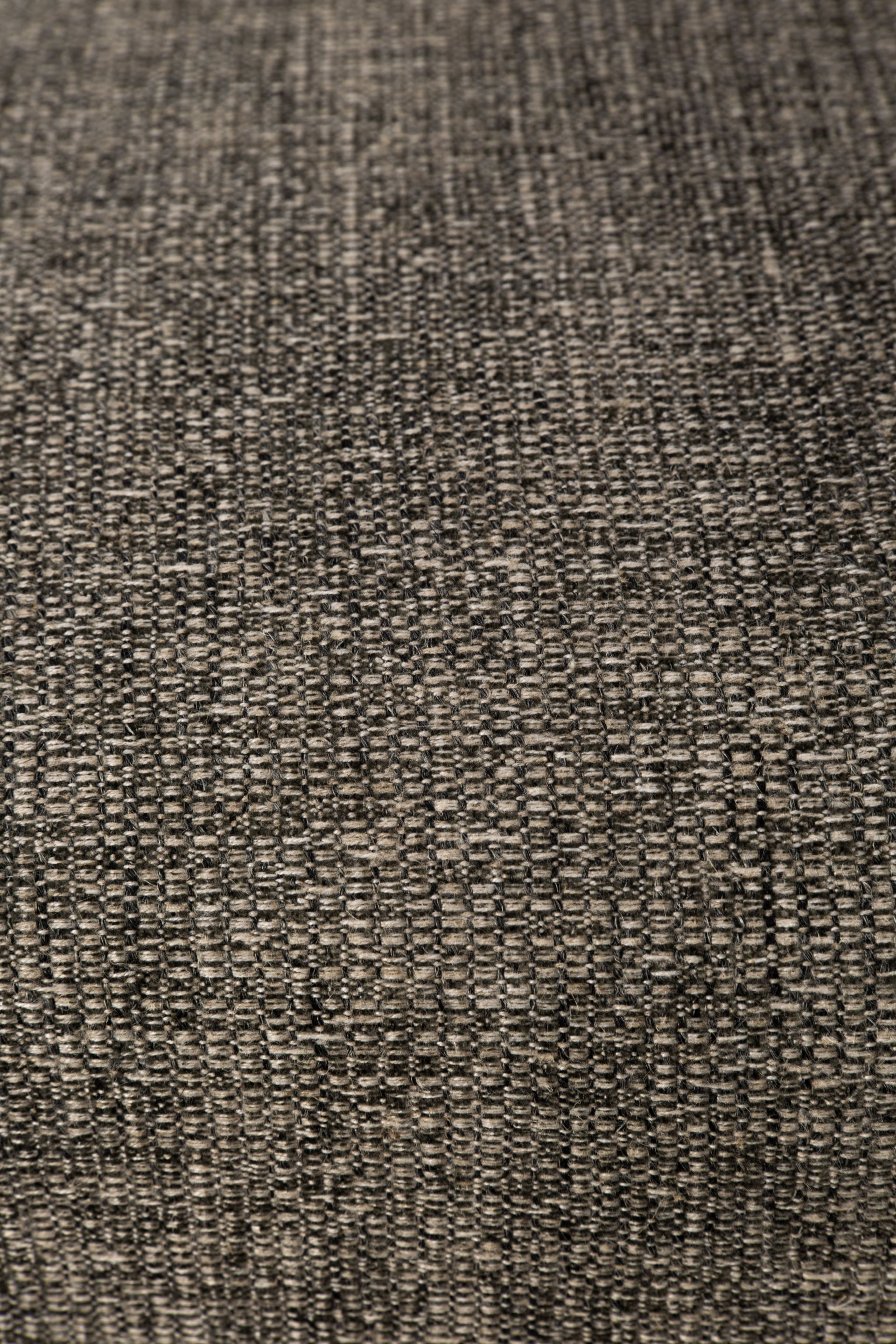 Detailaufnahme des Stoffes vom Ethnicraft Ellipse Sofa, ein gemütliches 3-Sitzer Sofa.