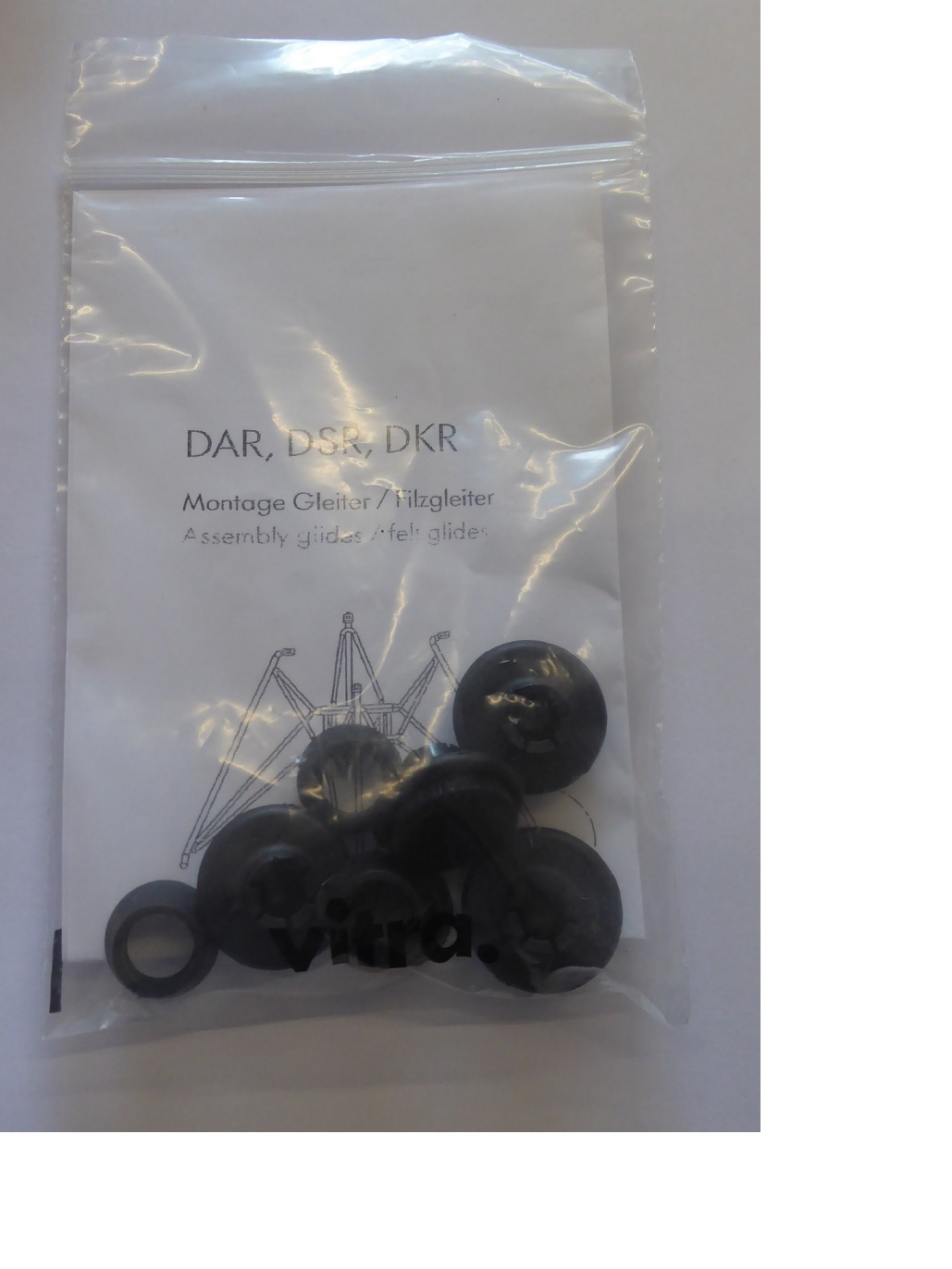 Schwarze Filzgleiter für Eames Plastic Chair DSR, DAR, DKR in transparenter Verpackung. Bodenschutz für Stühle.