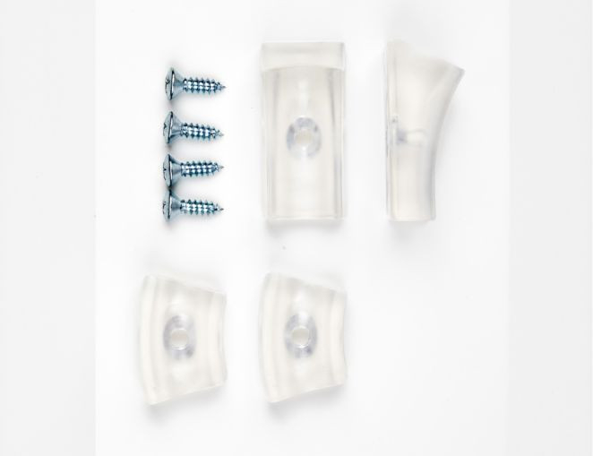 Bild von transparenten Kunststoffgleitern für Freischwinger Stühle, inklusive Schrauben zur Befestigung.