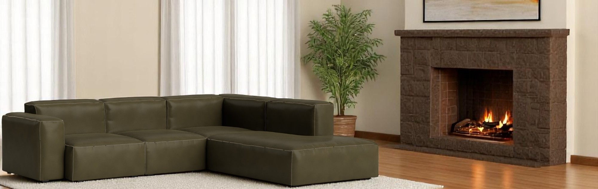 Grüne Mags Soft Sofa Eckkombination von Hay mit niedrigem Armteil und beigen Ziernähten.