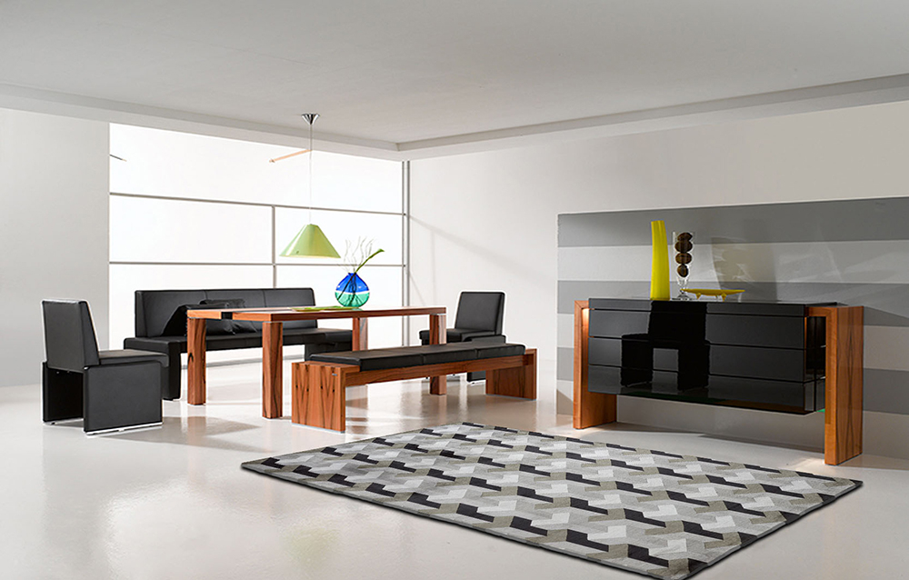 Moderner Wohnraum mit Esstischgruppe und grauem Teppich Verner Panton Ypsilon Silk von Designercarpets.