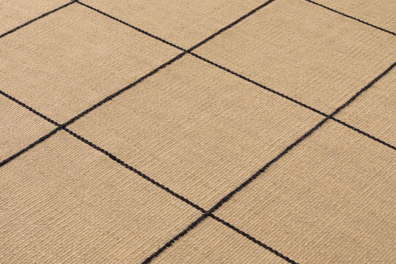 Nahaufnahme des Roots Teppichs mit schwarzem Rautenmuster, ein moderner Teppich für Wohnzimmer und Schlafzimmer.