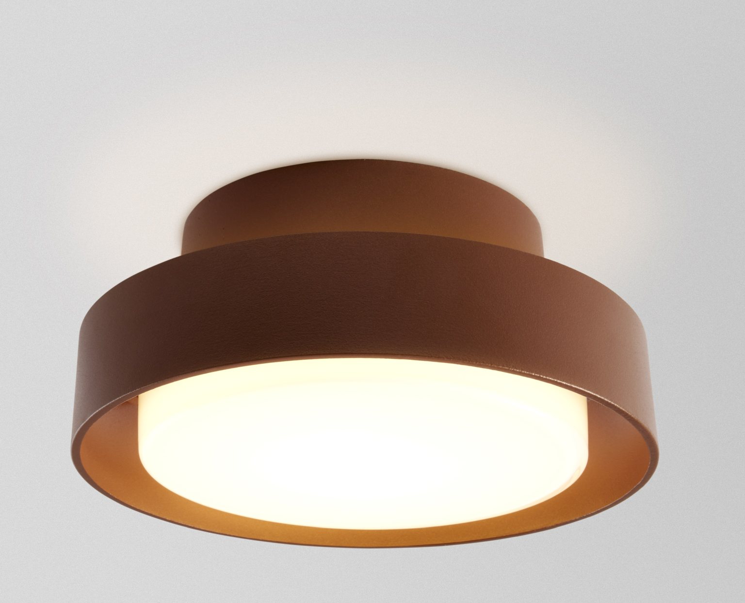 Rostbraune Plaff-On! Wandleuchte von Marset: Moderne IP65-Leuchte für Wandmontage, ideal für Innen- und Außenbereiche.