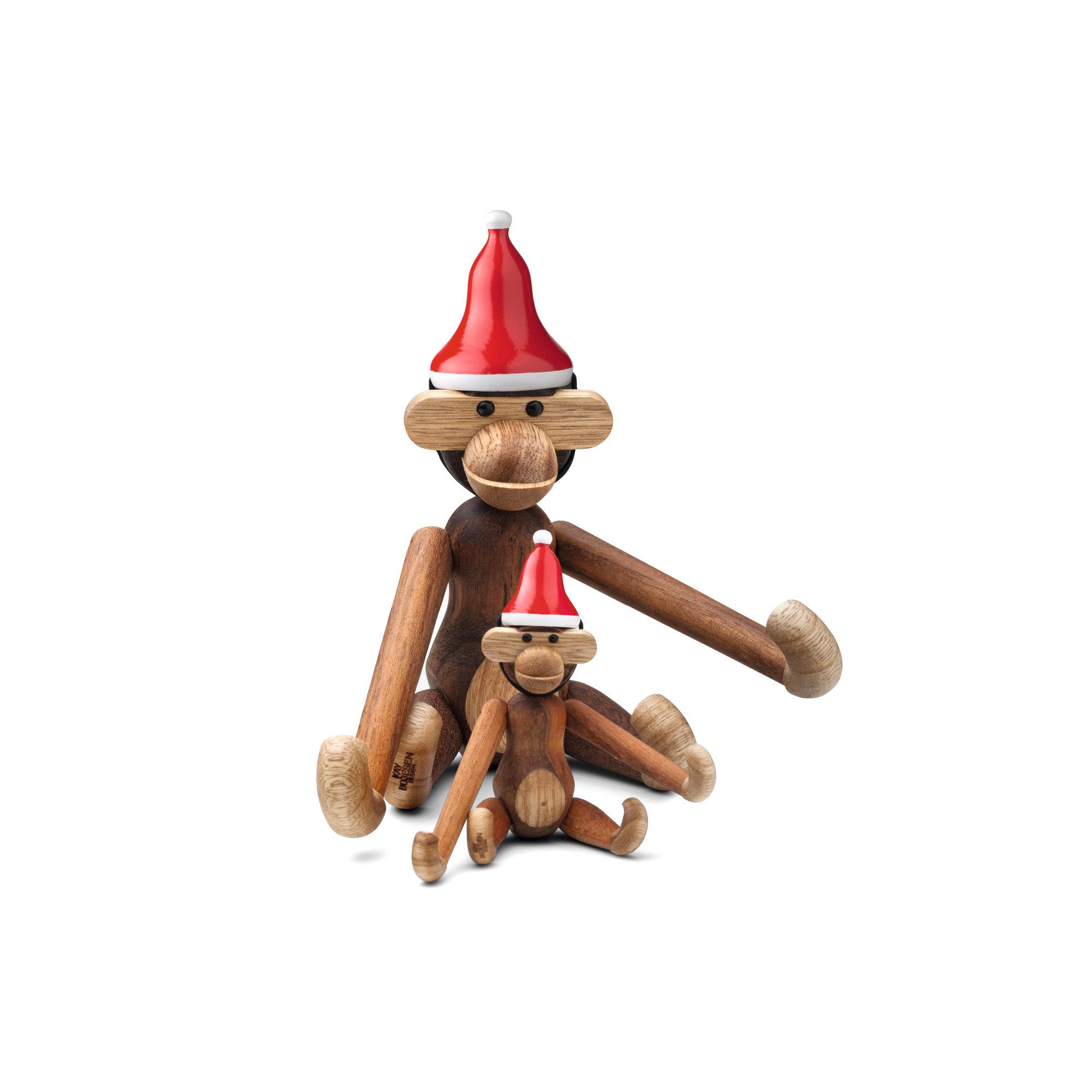 Kay Bojesen Affe Mini mit Weihnachtsmütze, zwei Holzaffen sitzen nebeneinander, festliche Weihnachtsdekoration.