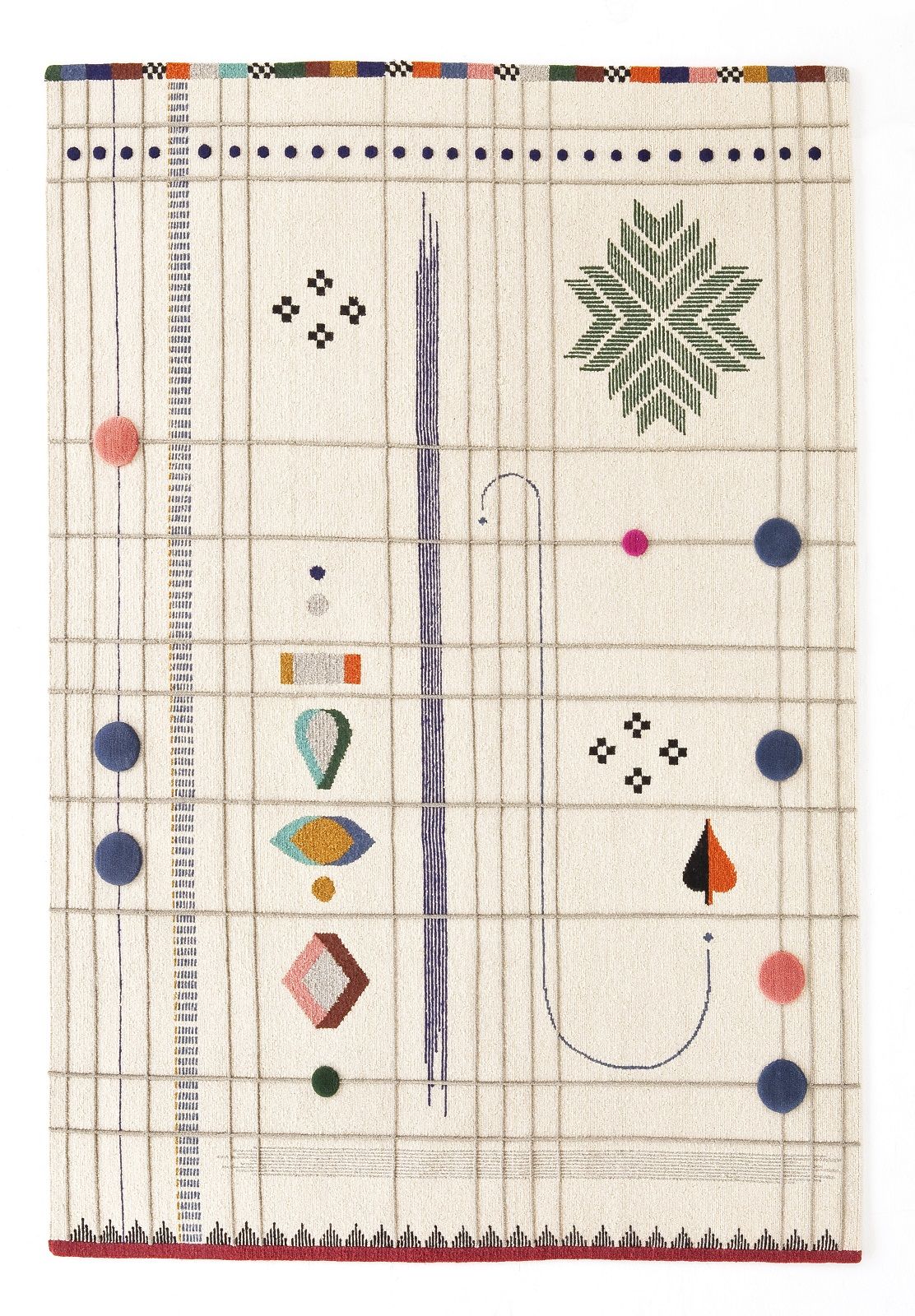 Detailansicht des Rabari Teppichs von Nanimarquina: Handgeknüpfter Wollteppich mit bunten, abstrakten Mustern und dekorativen Pompons.