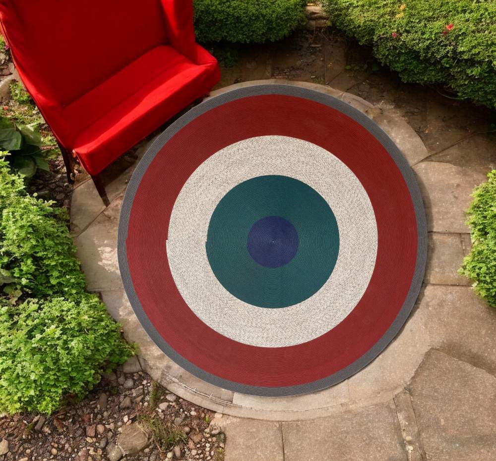 Runder Cassina Outdoor Teppich "Circus" in Bordeaux, Grau, Weiß, Grün und Blau.