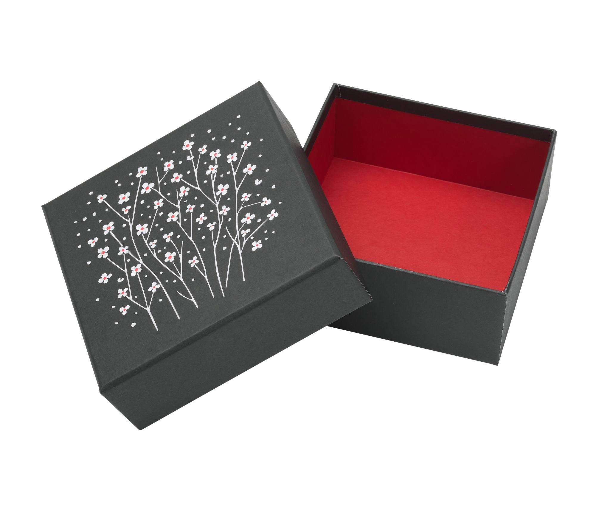 Offene Graphic Boxes Aufbewahrungsbox von Vitra, schwarzer Karton mit Blumenmuster und rotem Innenraum.