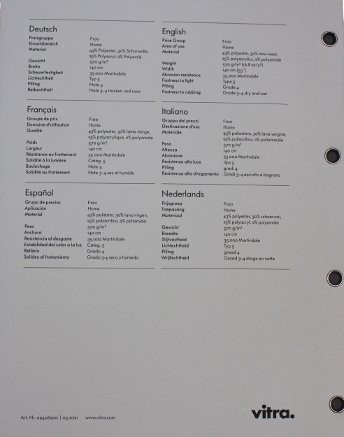 Nahaufnahme der Stoffmusterkarte Nubia Vitra mit Materialzusammensetzung und technischen Daten in mehreren Sprachen.