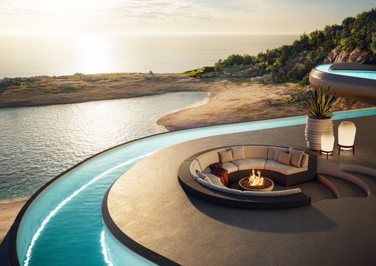 Loon Bodenleuchte von Dedon, Ø54cm, auf einer Terrasse mit Meerblick und Feuerstelle.