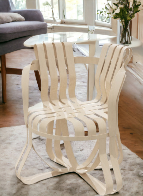 Cross Check Stuhl von Knoll International mit Armlehnen, modernes Design aus hellem Holz.