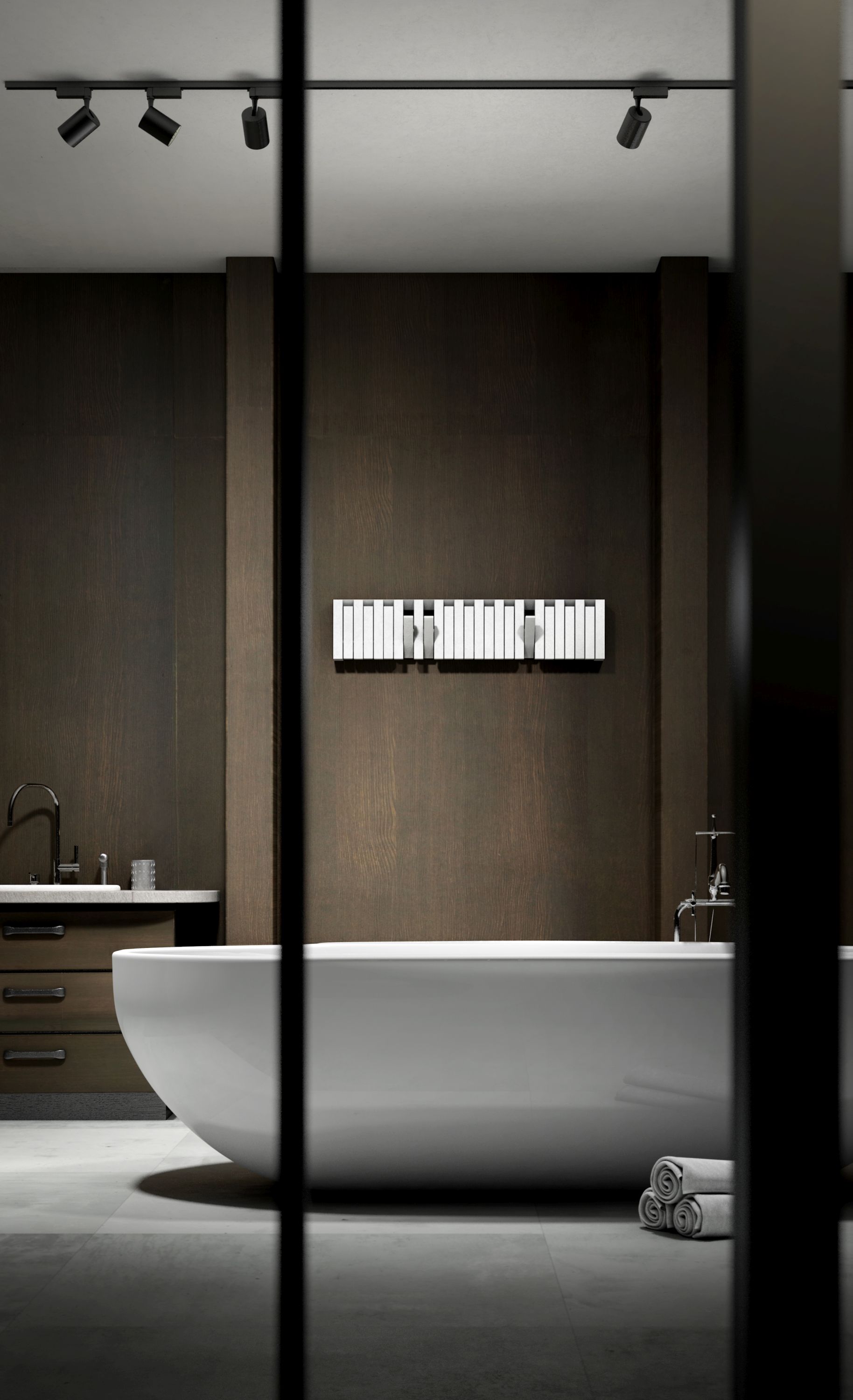 Moderne Badezimmer-Szene mit freistehender Badewanne und XYLO Wandgarderobe von PER/USE an dunkler Holzvertäfelung.