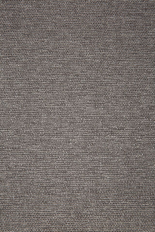 Detailaufnahme des mokkafarbenen Stoffbezugs vom Jack Outdoor Polsterhocker von Ethnicraft.