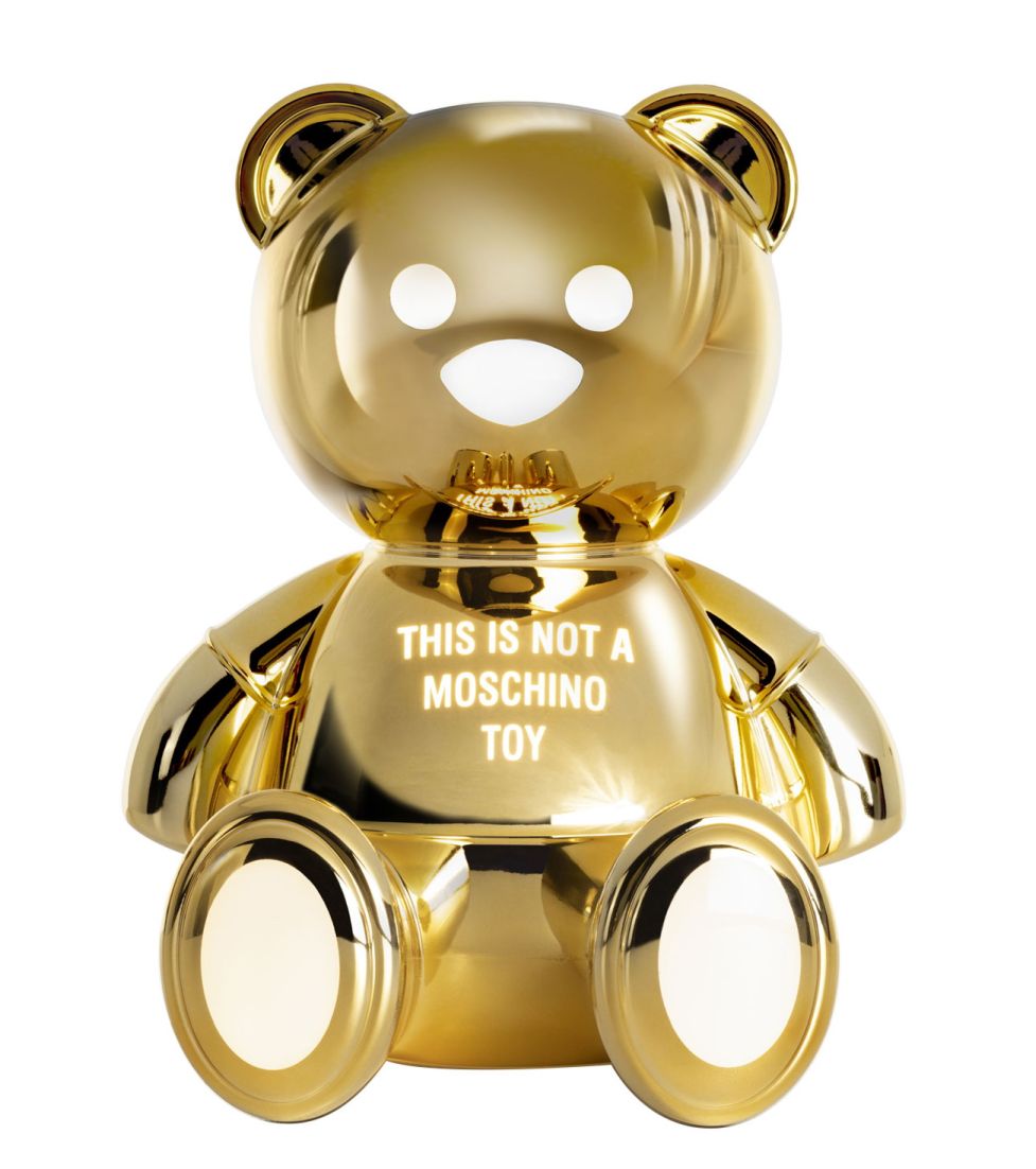 Goldene Toy Moschino Bär Tischleuchte von Kartell, glänzende Designerlampe in Bärenform für Kinderzimmer und Wohnraum.