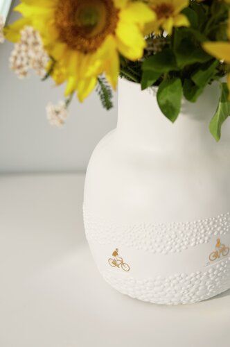 Vase Fahrt durchs Blumenfeld Räder