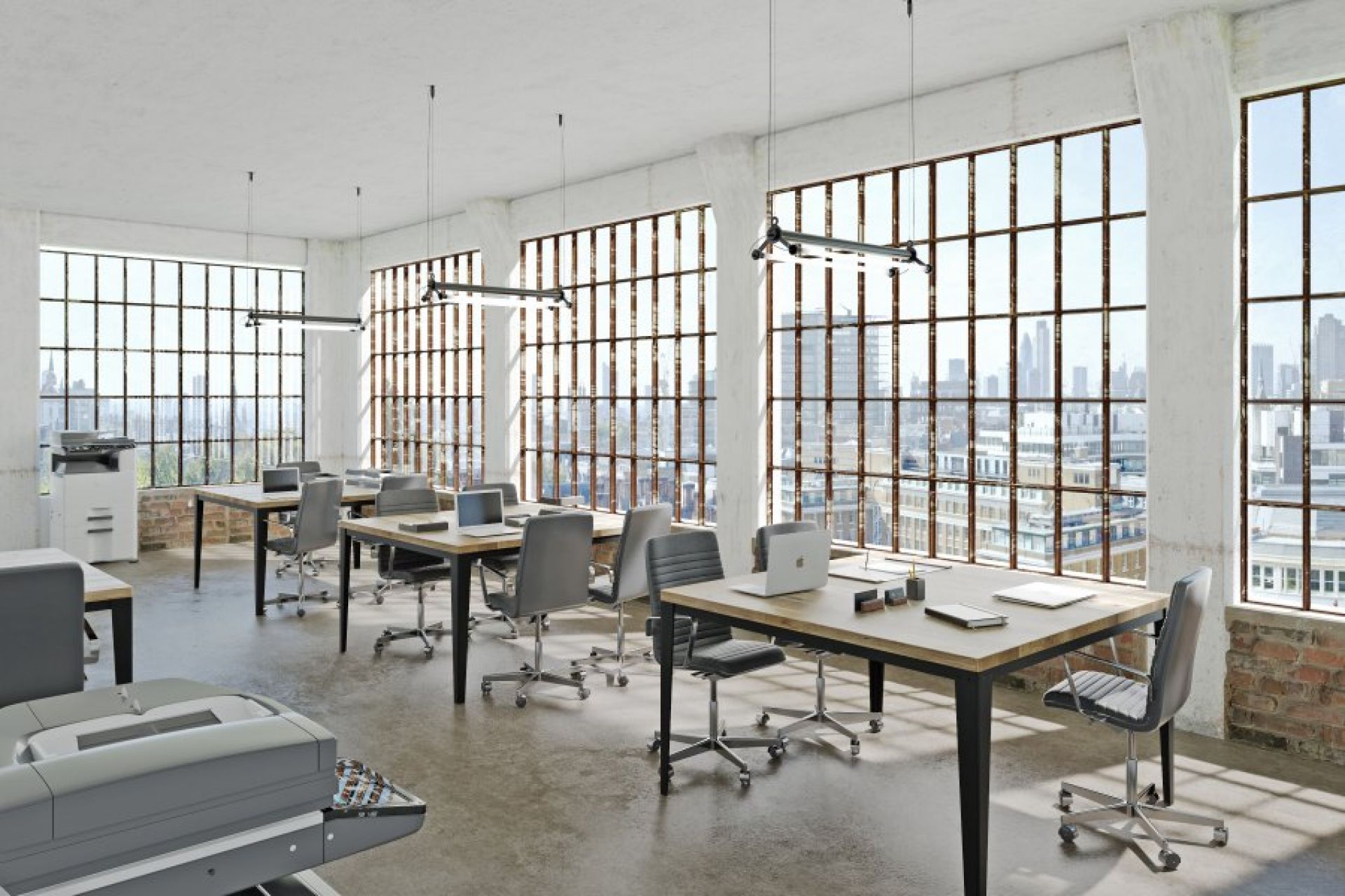 Büroraum mit mehreren Floy Esstischen Trebord aus Holz und schwarzen Metallbeinen.