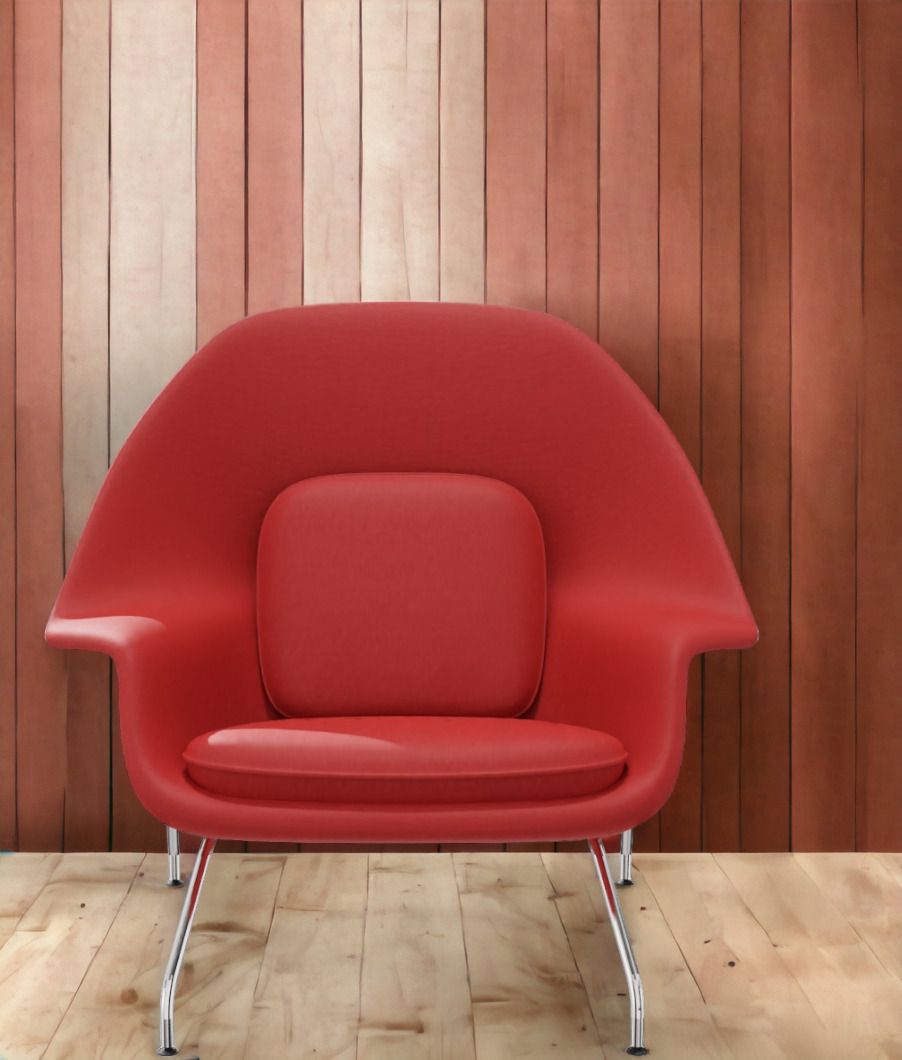 Roter Womb Chair Sessel von Knoll International mit Chromgestell vor einer Holzwand.