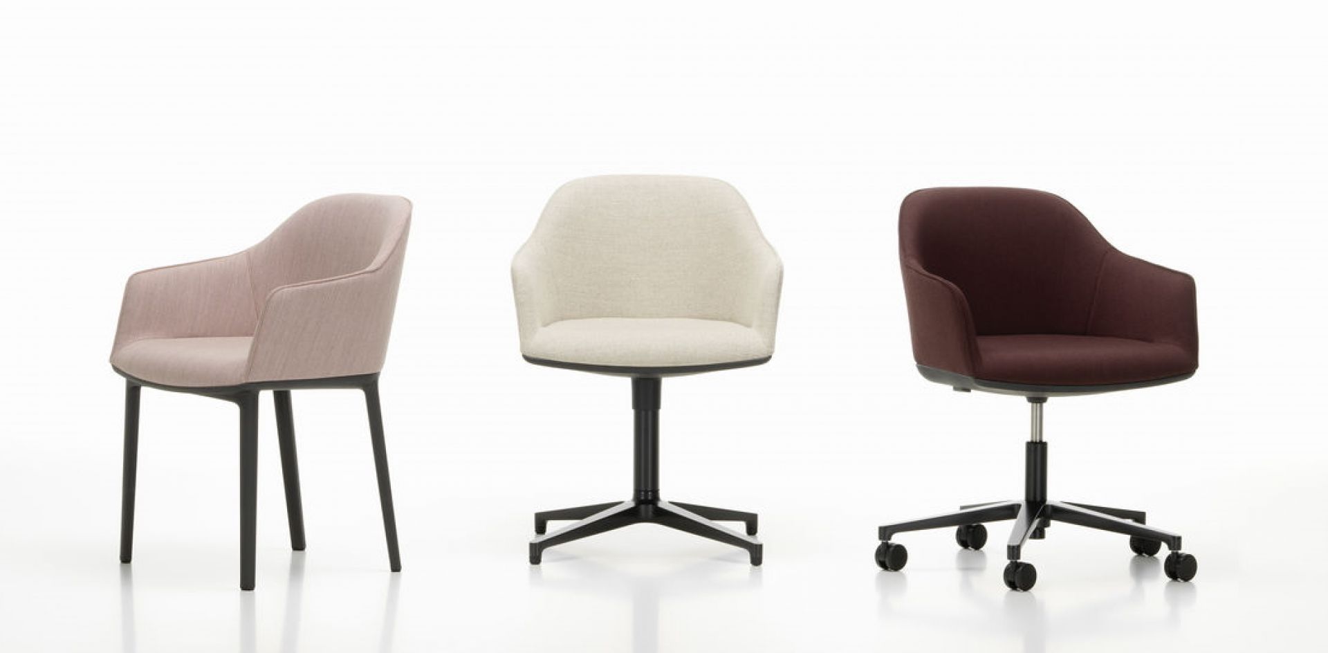Drei Vitra Softshell Chairs in Rosa, Beige und Braun mit unterschiedlichen Untergestellen.