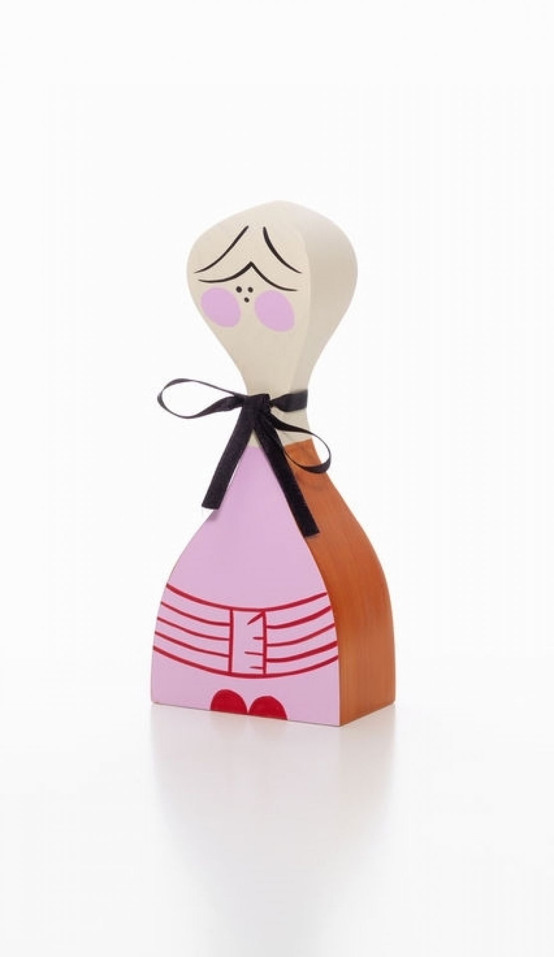 Vitra Wooden Doll No. 2, dekorative Holzfigur mit schwarzer Schleife und handbemaltem Gesicht.