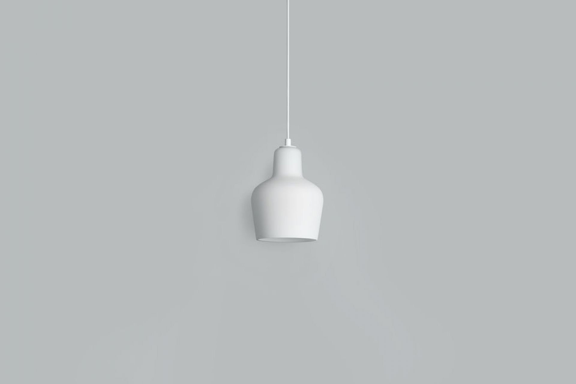 Weiße A440 Hängeleuchte von Artek mit minimalistischem Design und sanftem Lichtschein für moderne Innenräume.