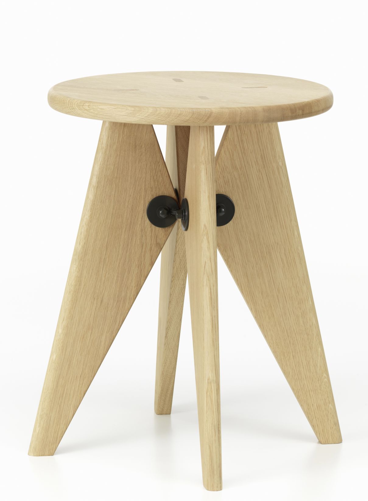 Tabouret Bois Hocker: Runder, heller Holz-Hocker mit drei Beinen und schwarzen Verbindungsstücken.