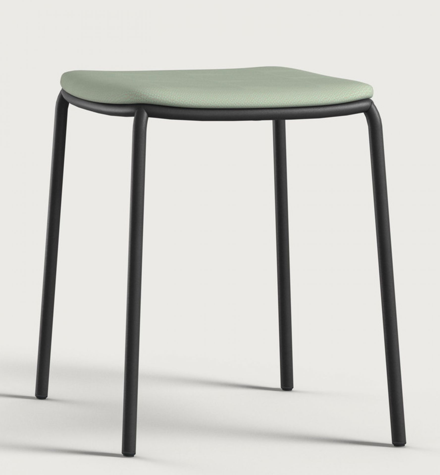 Nate Hocker von Brunner: Moderner Hocker mit grünem Sitzpolster und schwarzem Metallgestell.