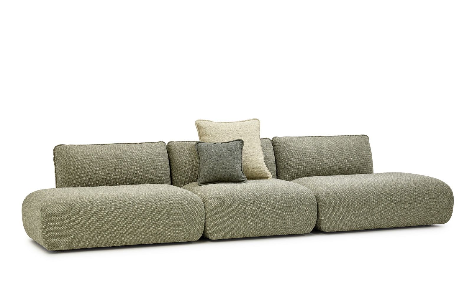 Mia Modular Sofa von Freifrau Manufaktur in Grün mit Kissen, modernes Wohnzimmer Design.