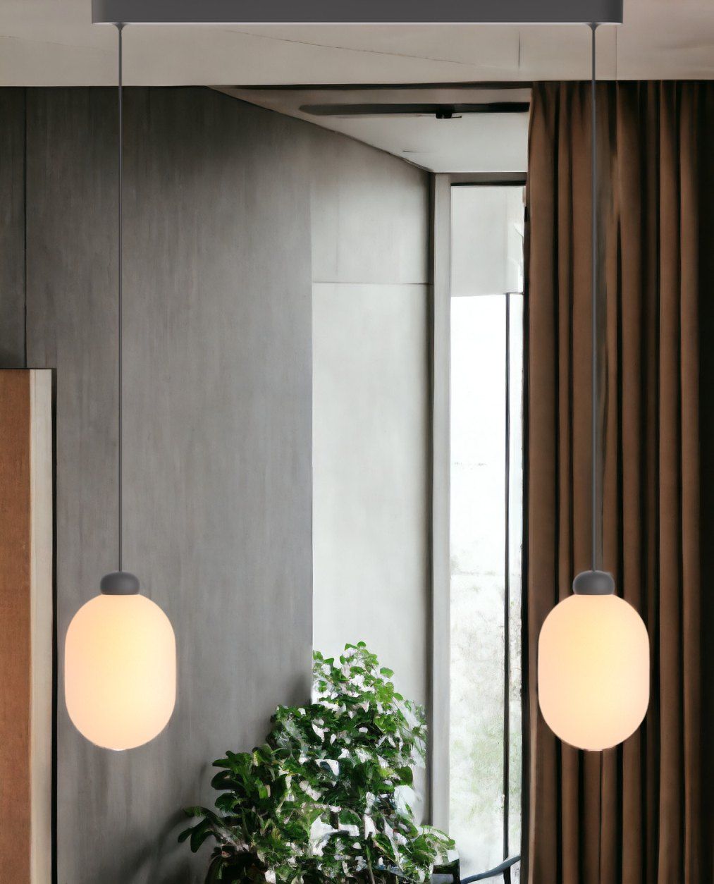 Sun Duo Pendelleuchte in Grau: Zwei moderne Hängelampen mit runden, leuchtenden Glaskörpern für stilvolle Beleuchtung.