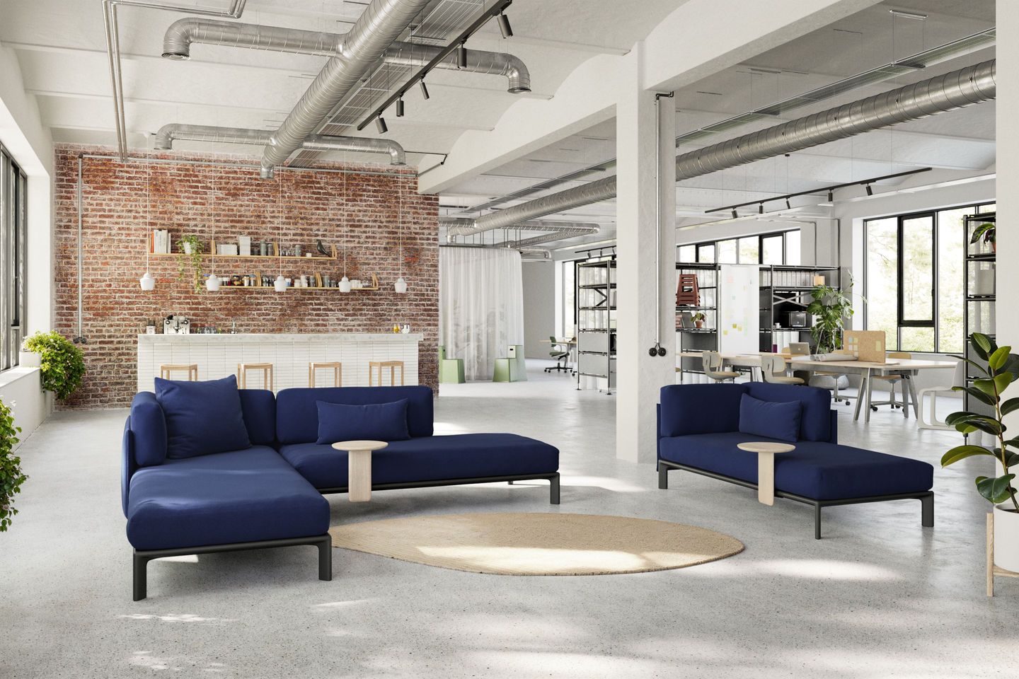 Blaues Anagram Sofa von Vitra, 90x180 cm, in modernem Büro-Loft mit Teppich.