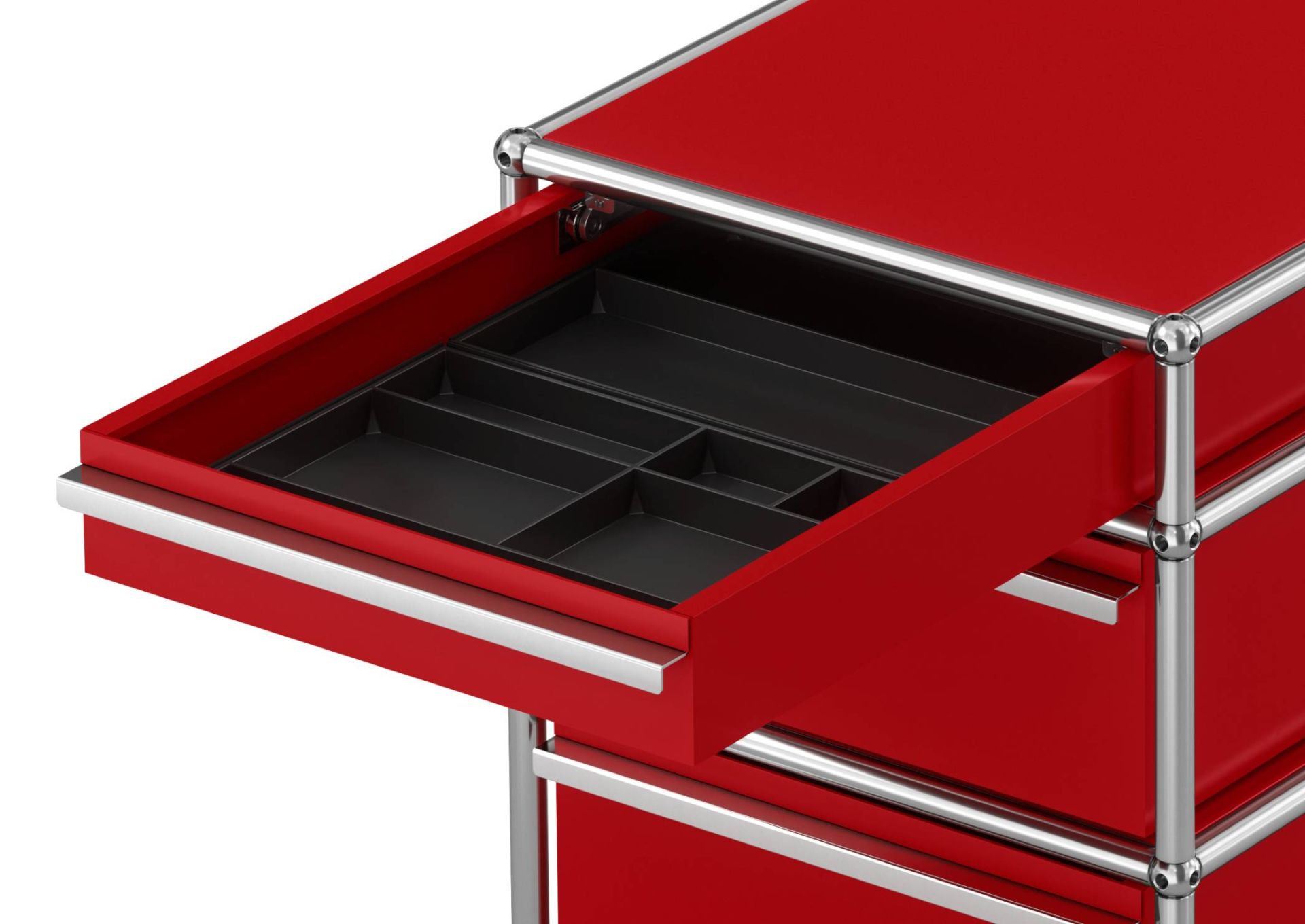 USM Haller Rollcontainer in Rubinrot, Detailaufnahme einer geöffneten Schublade mit Fächereinteilung, modernes Büromöbel.