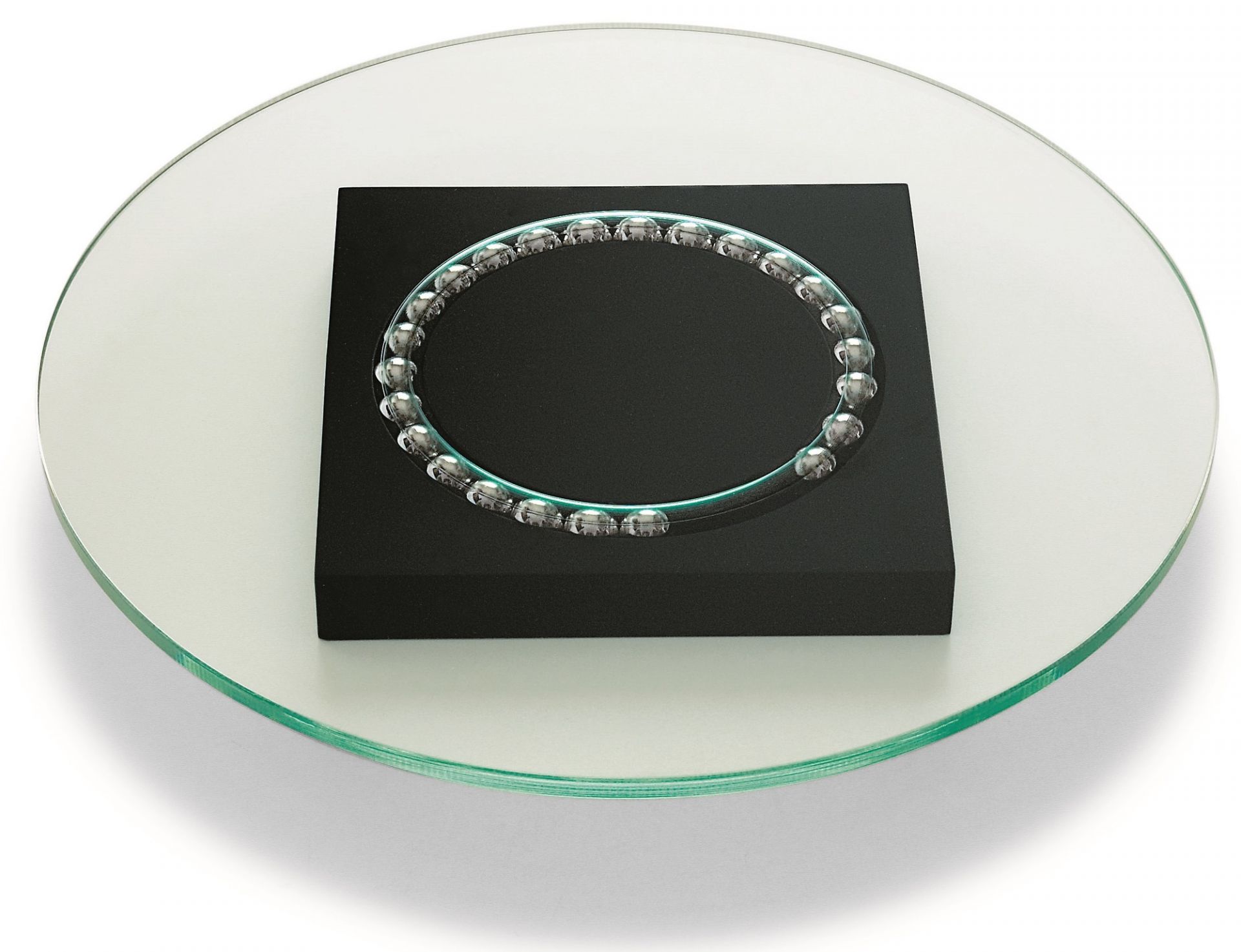 Philippi Lazy Susi Drehteller aus Glas mit schwarzem Sockel und Kugellager für Tischdekoration.