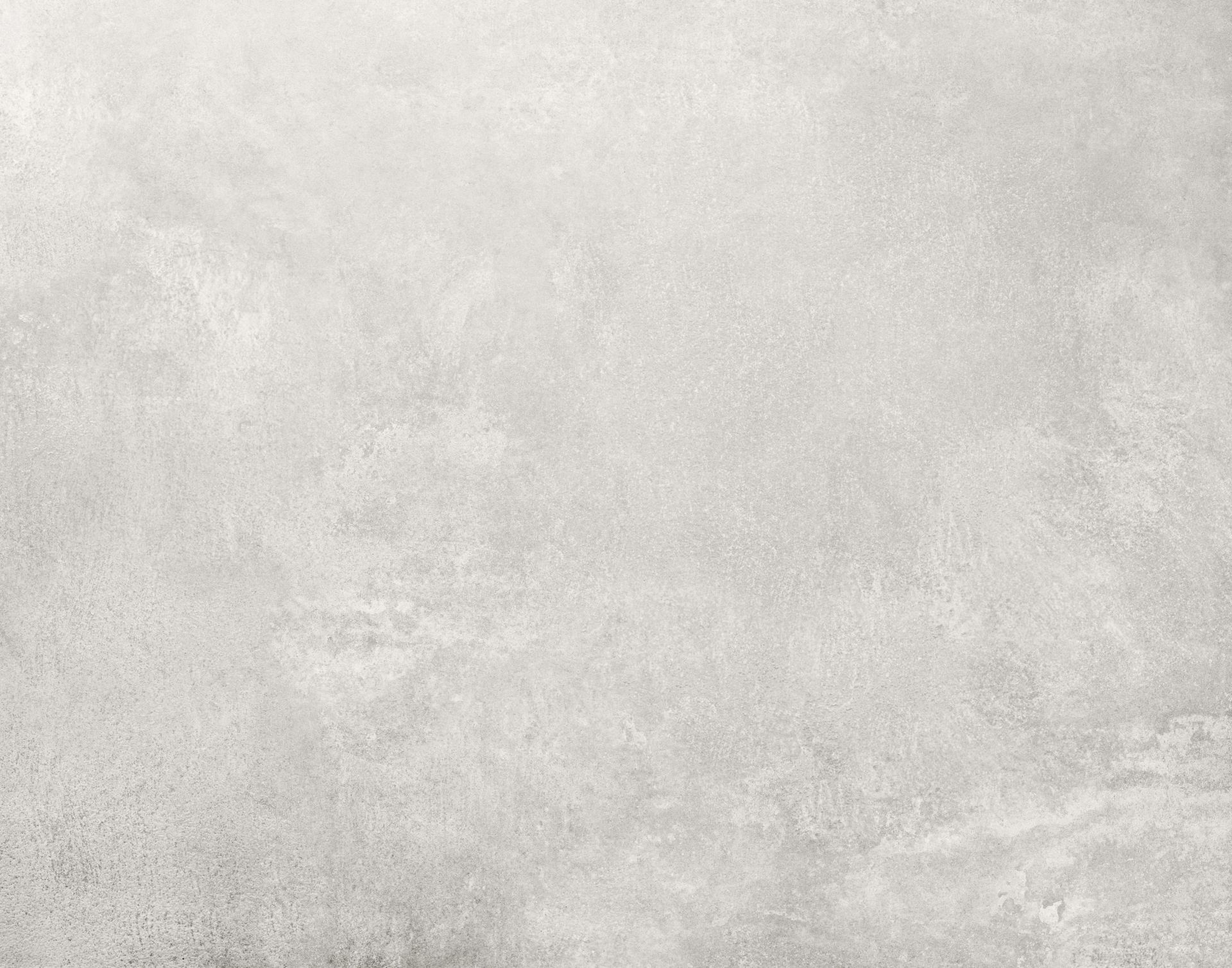 Detailaufnahme der Tischplatte vom Vipp Tisch groß, aus hellgrauem, poliertem Marmor.