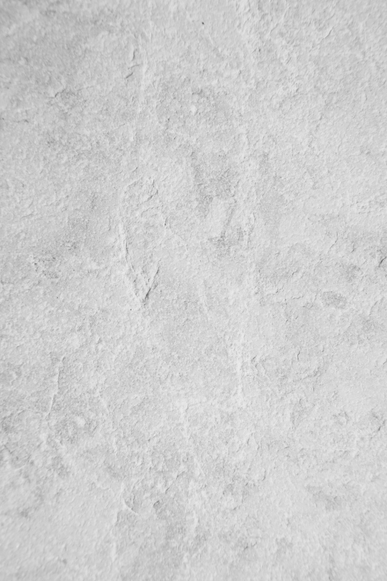 Nahaufnahme der Tischplatte des Vipp Couchtischs mit rechteckiger Form und grauer Oberfläche.