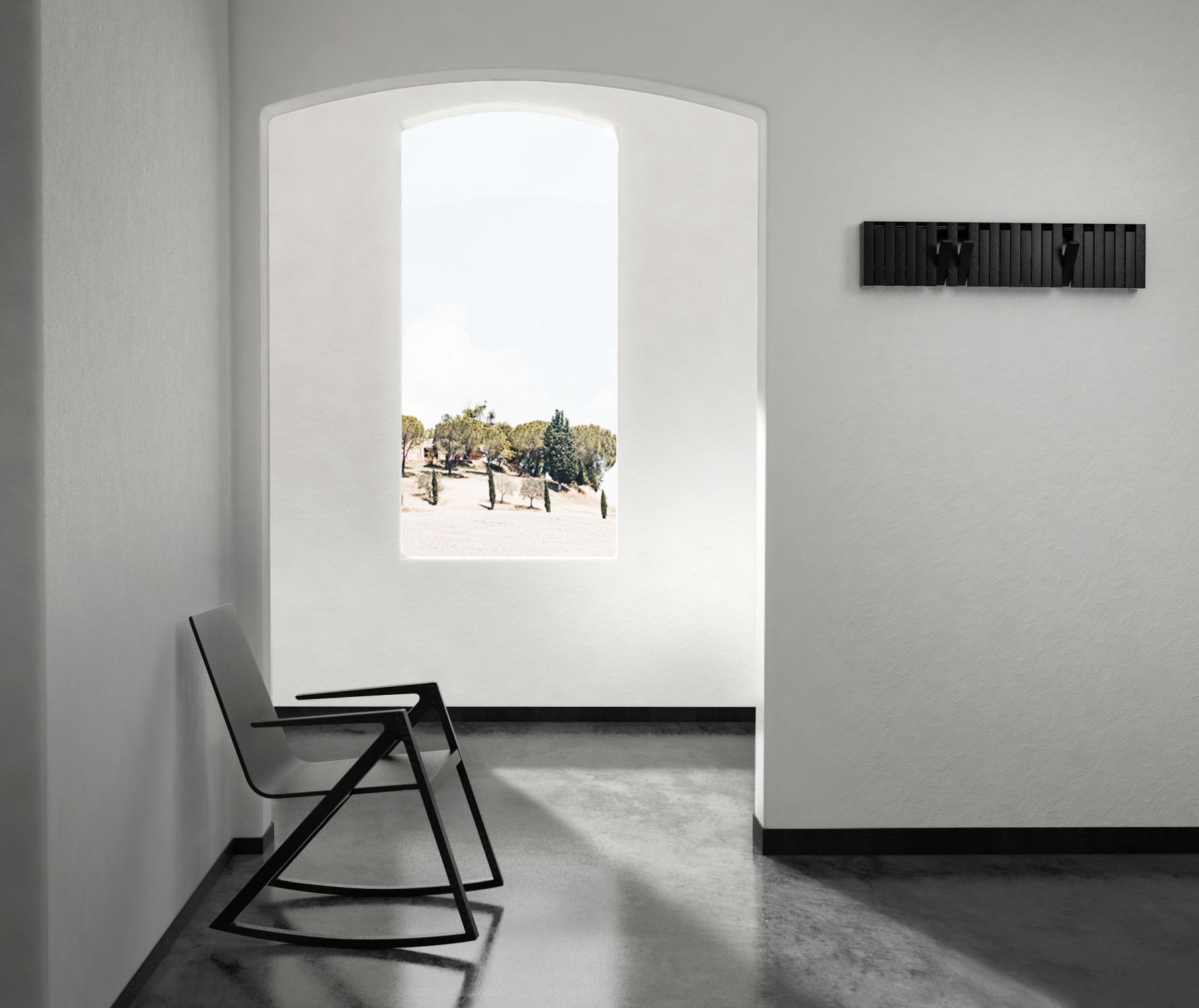 Minimalistischer Flur mit XYLO Wandgarderobe, Design-Stuhl und Blick durch ein Fenster auf eine Landschaft.
