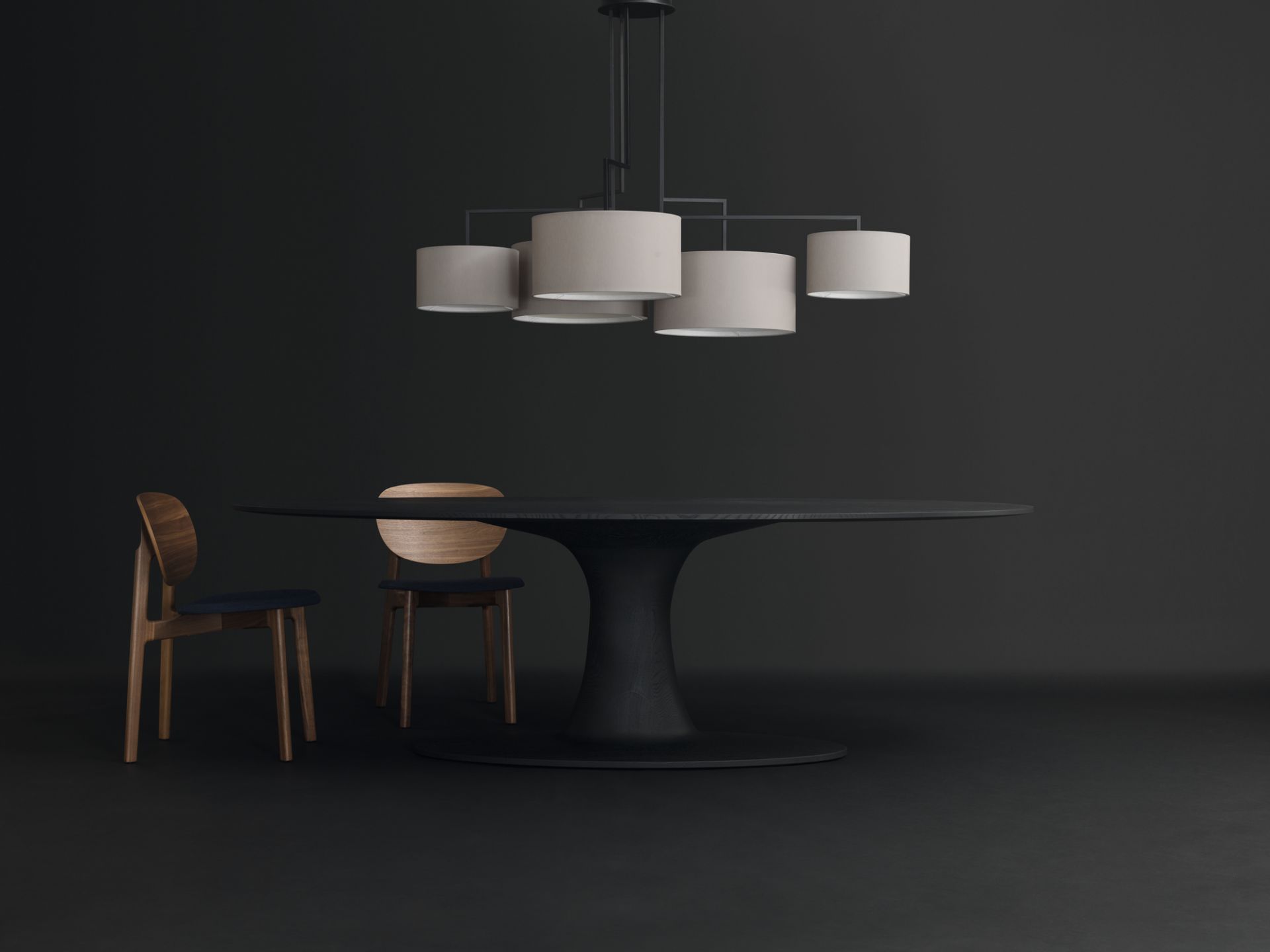 Noon 5 LED Leuchte in Schwarz über Esstisch mit Stühlen, modernes Design.