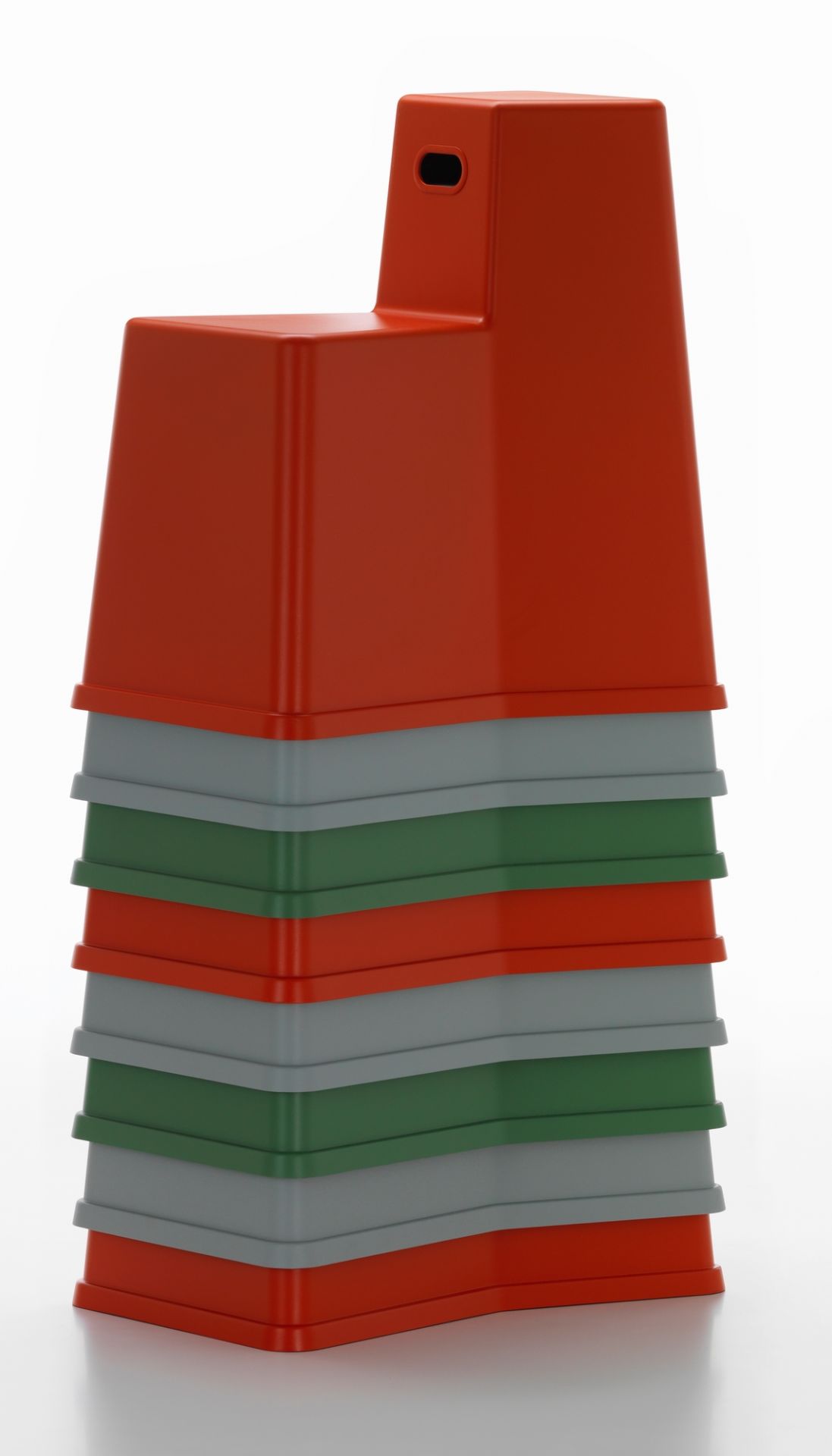 Stapel von Vitra Stool Tool Hockern in Rot, Grau und Grün. Designmöbel.