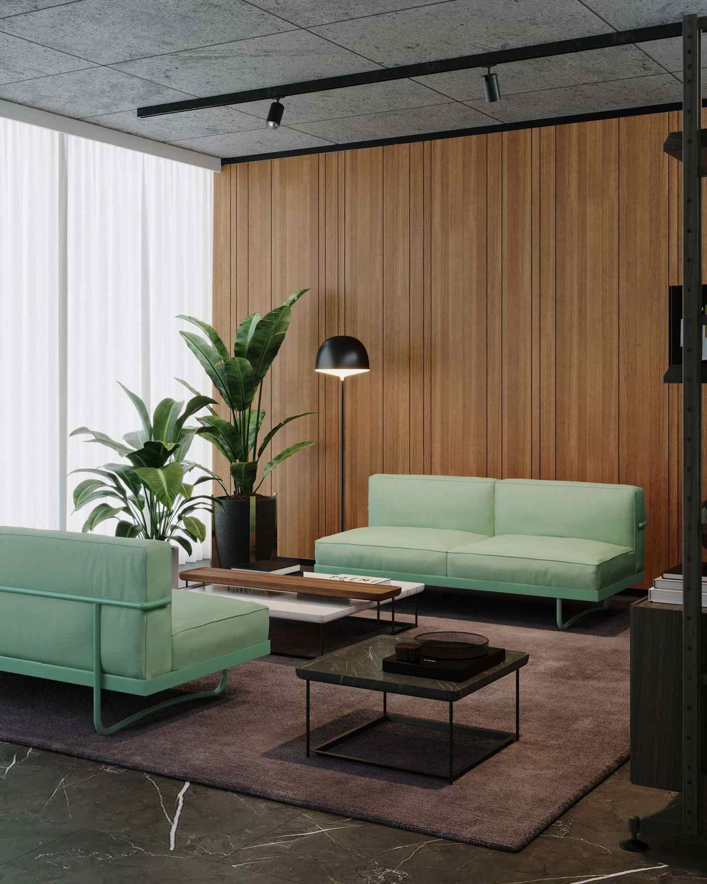 Helles LC5 Canapé Sofa von Cassina im modernen Wohnzimmer mit Holzwand und Pflanzen.